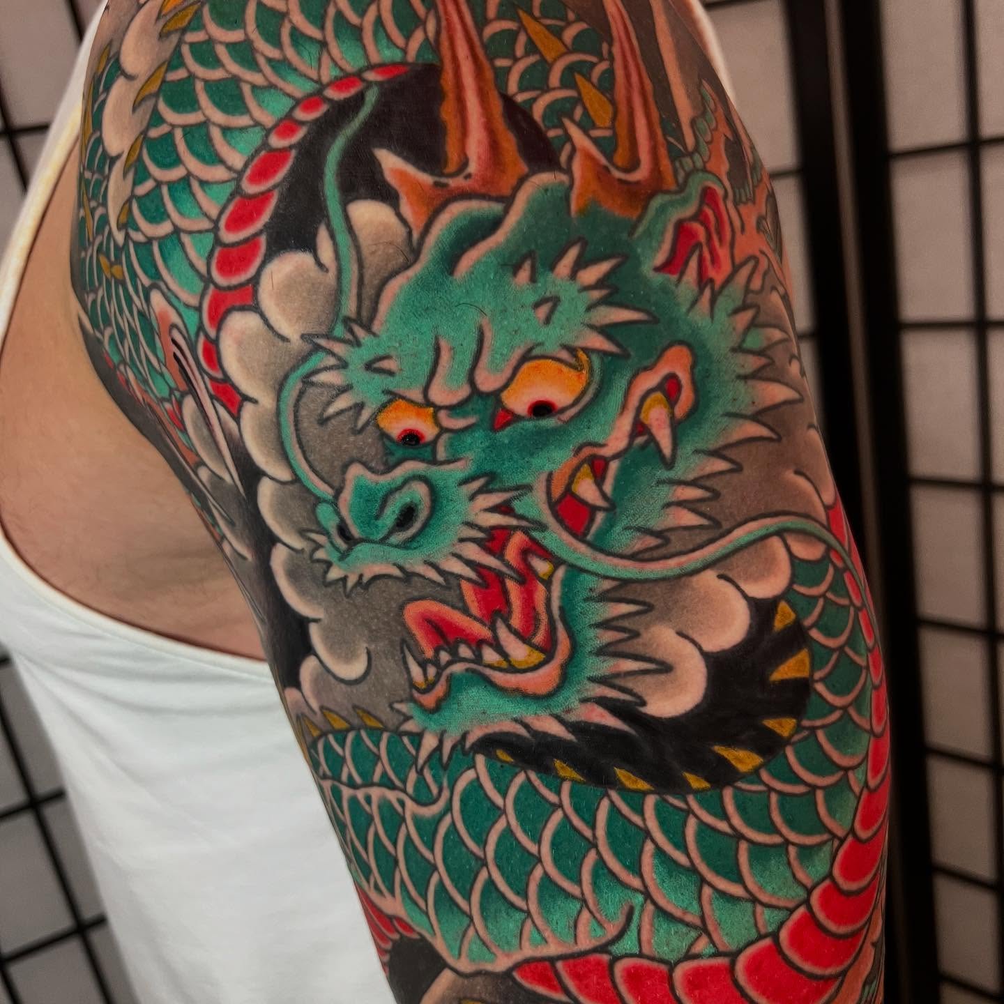 Dragon japanese irezumi tattoo on the upper arm by Brandon Mizrahi