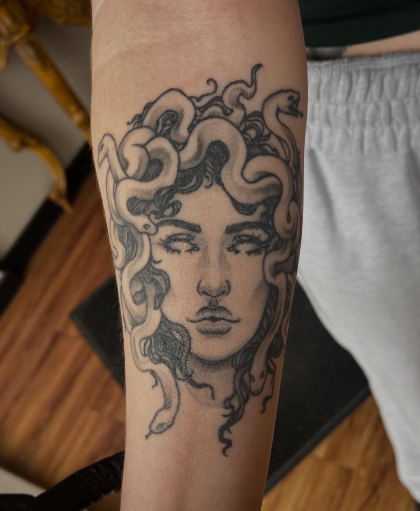Medusa black and grey tattoo on the forearm by Taylor Santavicca