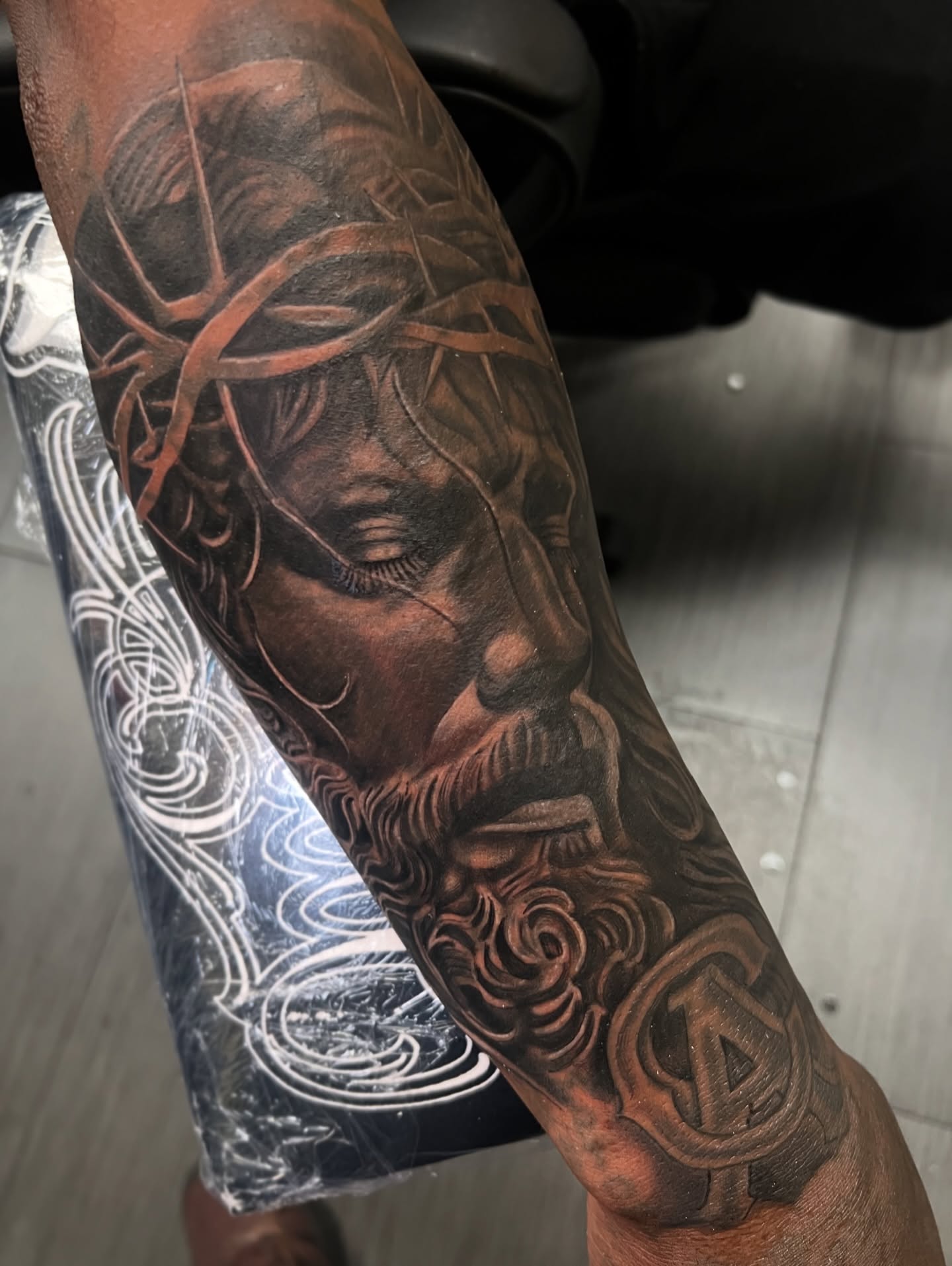 Religious figure realism tattoo on the forearm by Vondrae