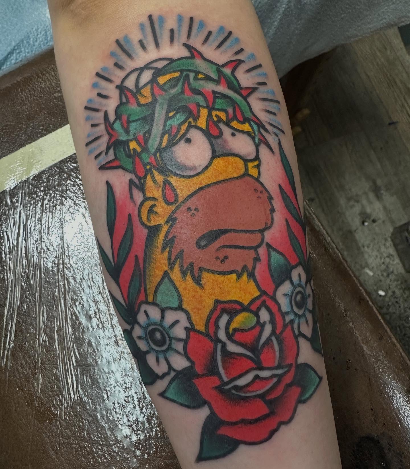 Homer simpson American traditional tattoo on the forearm by Devin Spenny