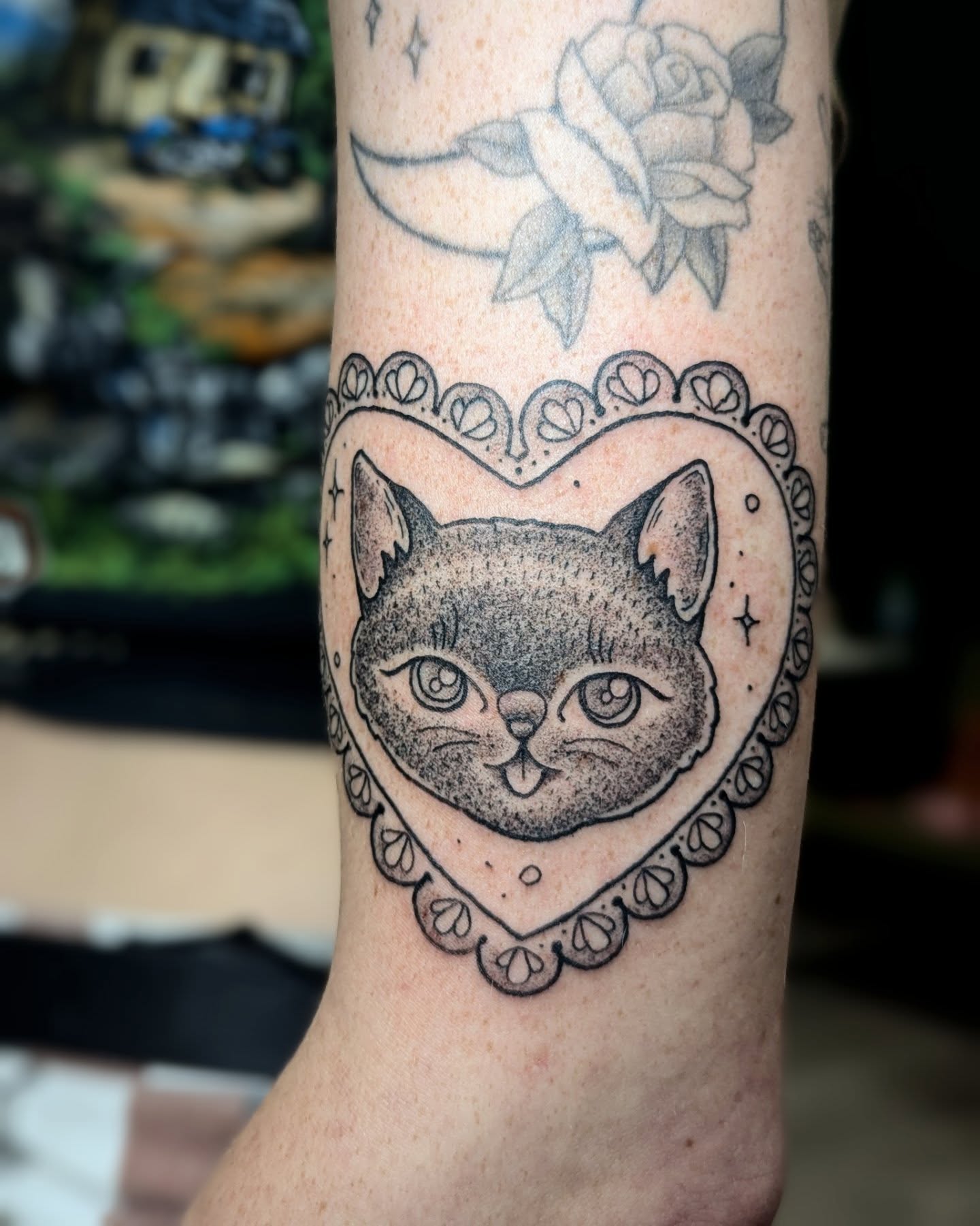 Cat dotwork tattoo on the forearm by Dani Harkey