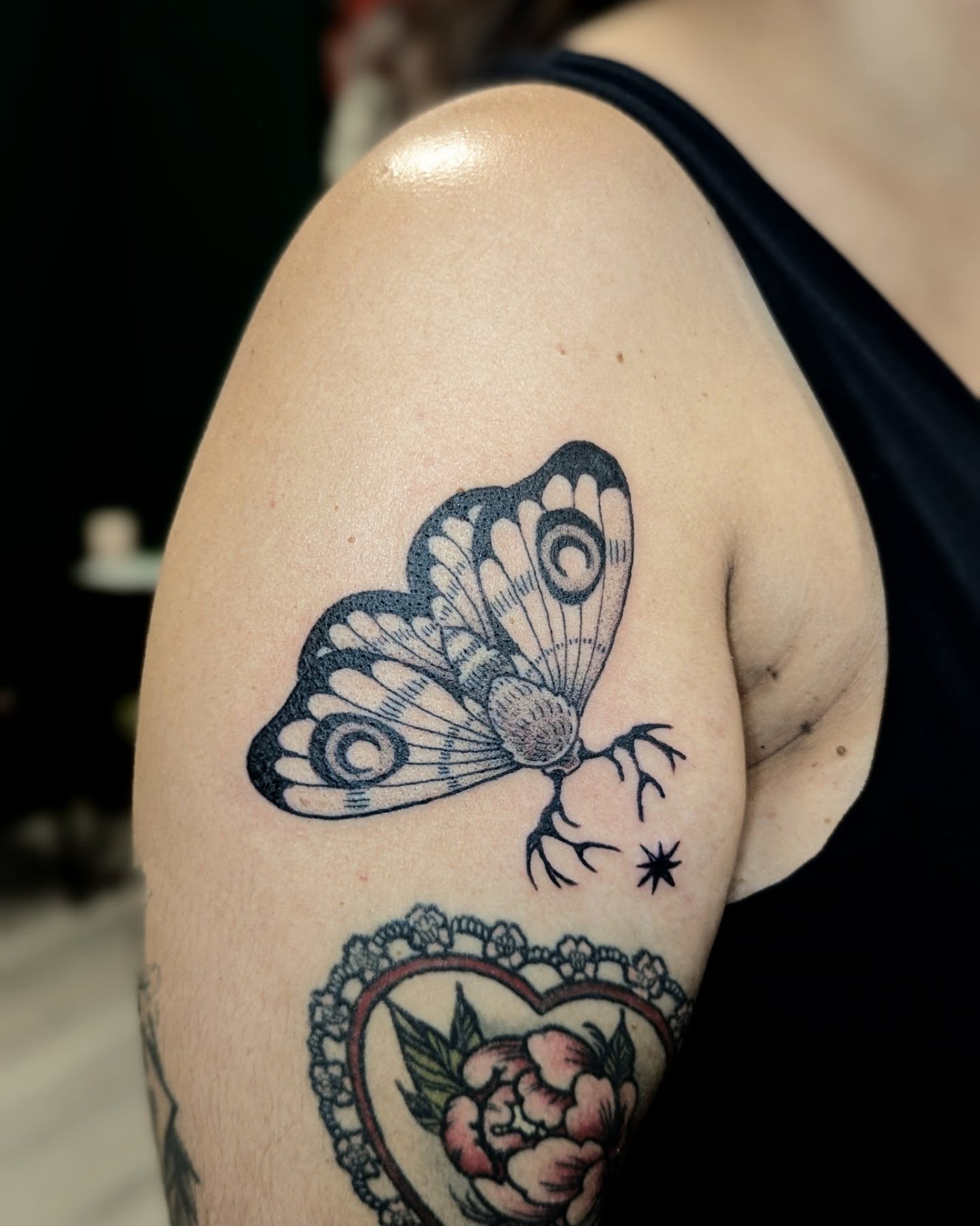 Butterfly American traditional tattoo on the shoulder by Dani Harkey