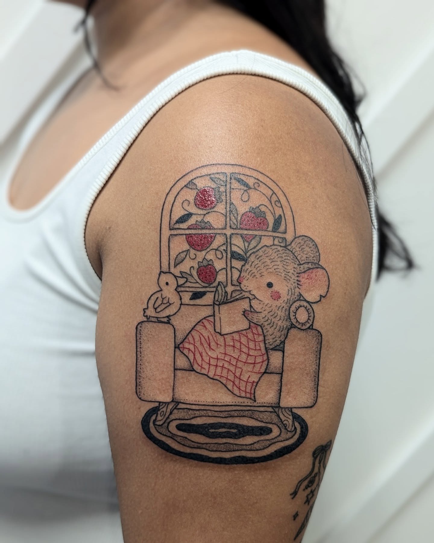 Mouse reading illustrative tattoo on the shoulder by Dani Harkey