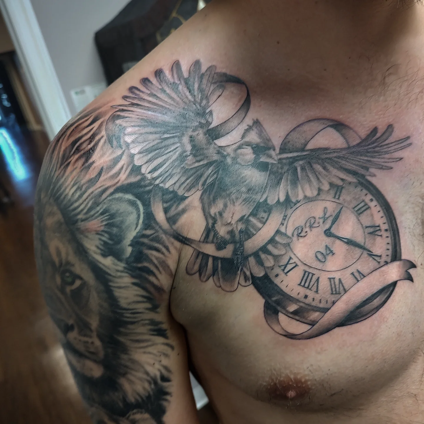 Clock and bird realism tattoo on the chest by Jennifer Fowler