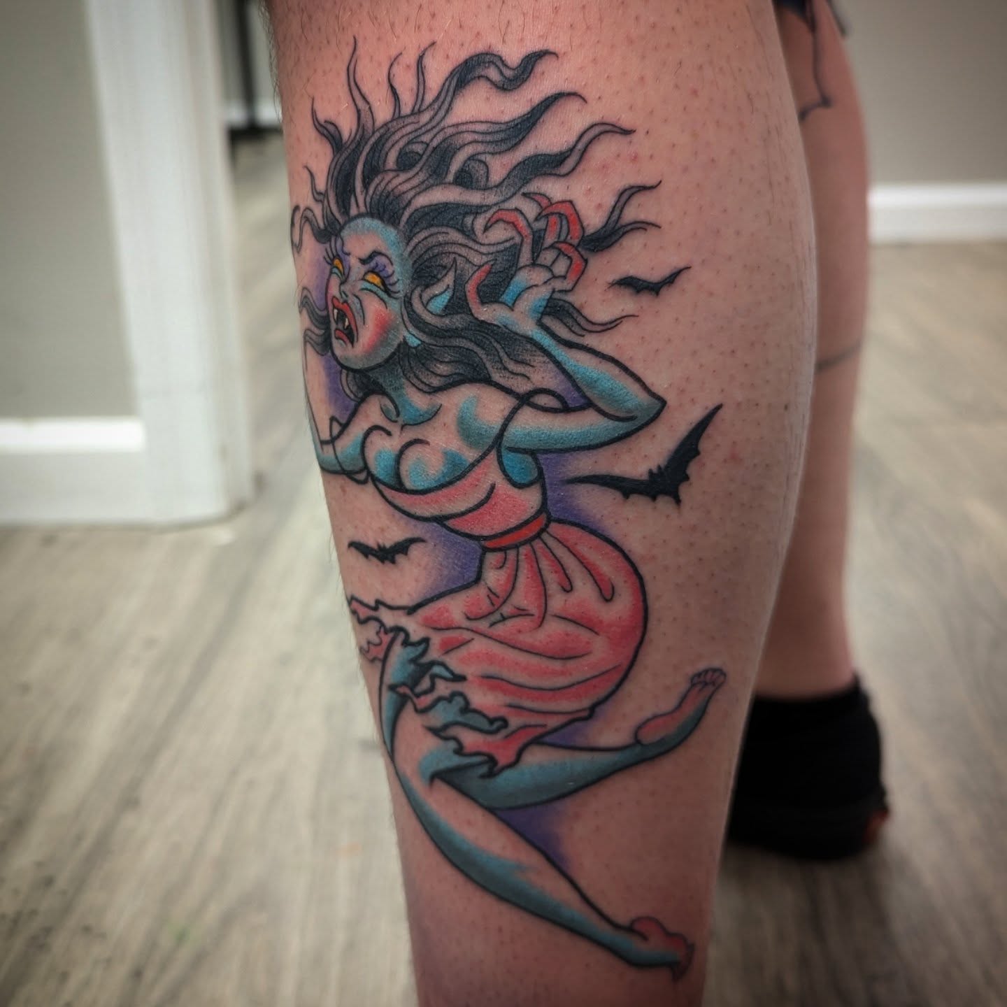 Mermaid American traditional tattoo on the thigh by Ryan Slegel