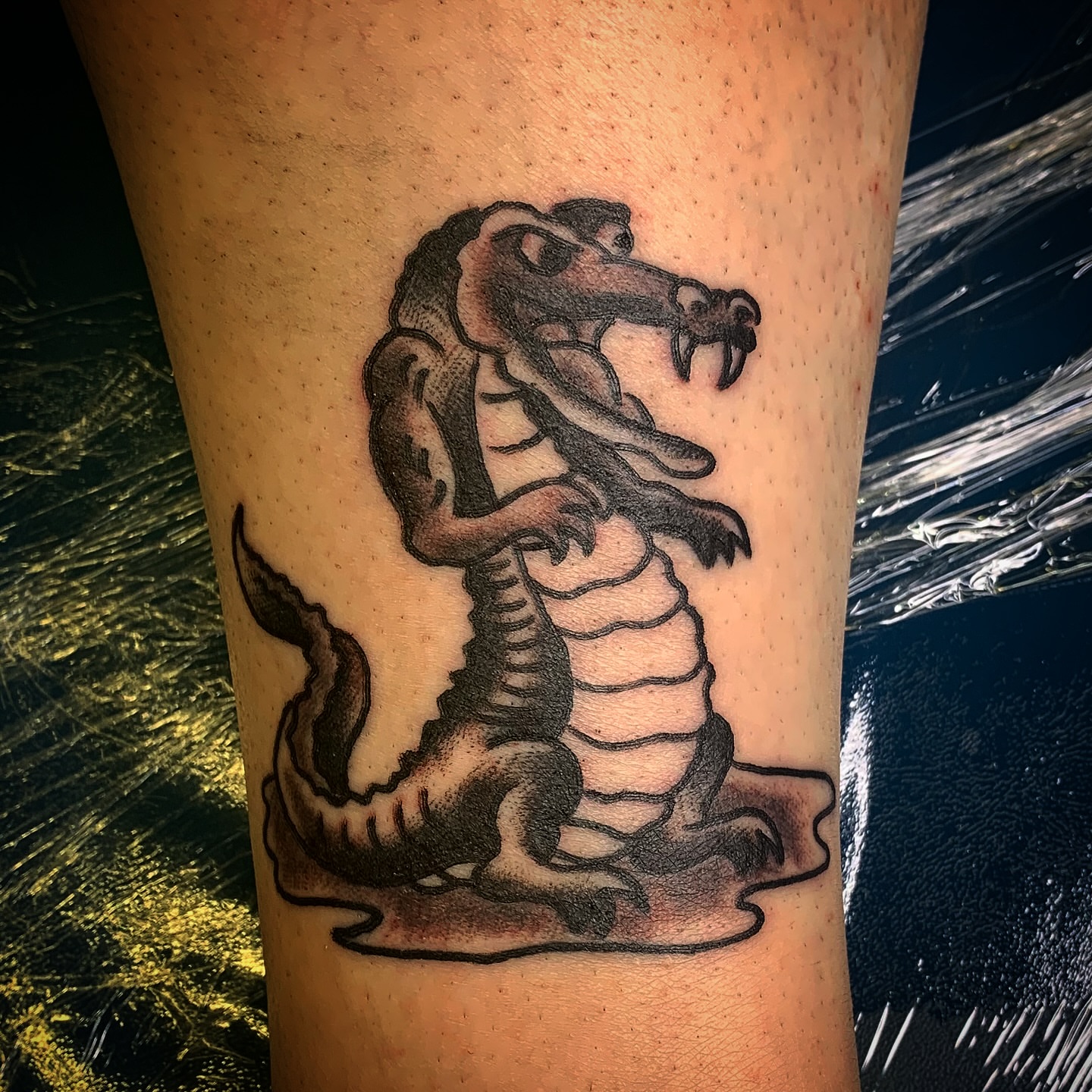 Alligator black and grey tattoo on the forearm by Tattoos Las Vegas,NV