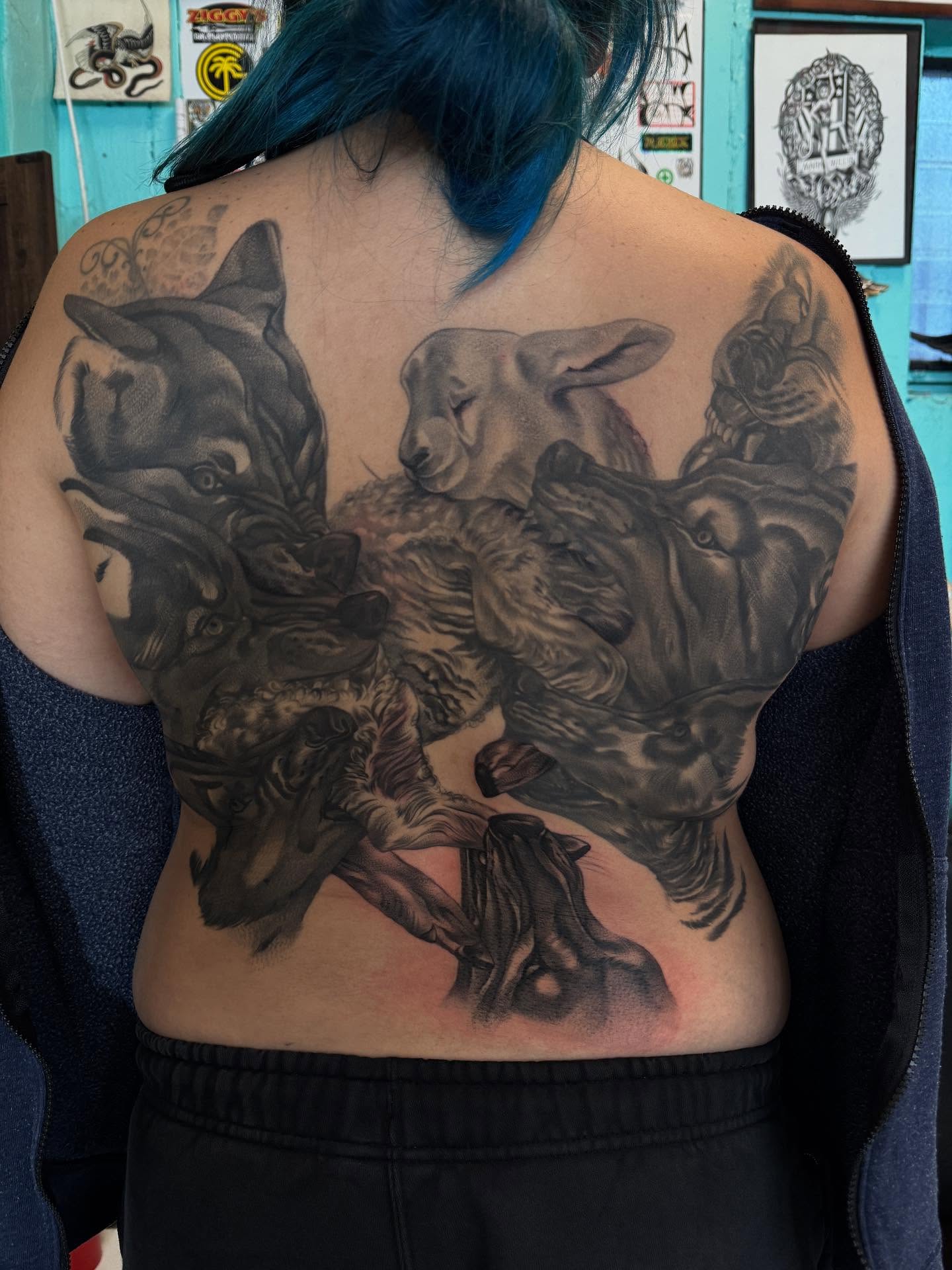 Wolf pack realism tattoo on the back by Carla V