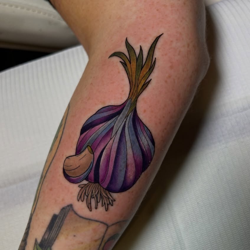 Garlic bulb realism tattoo on the forearm by Tattoos By Lola Cavotta, Willoughby, Ohio