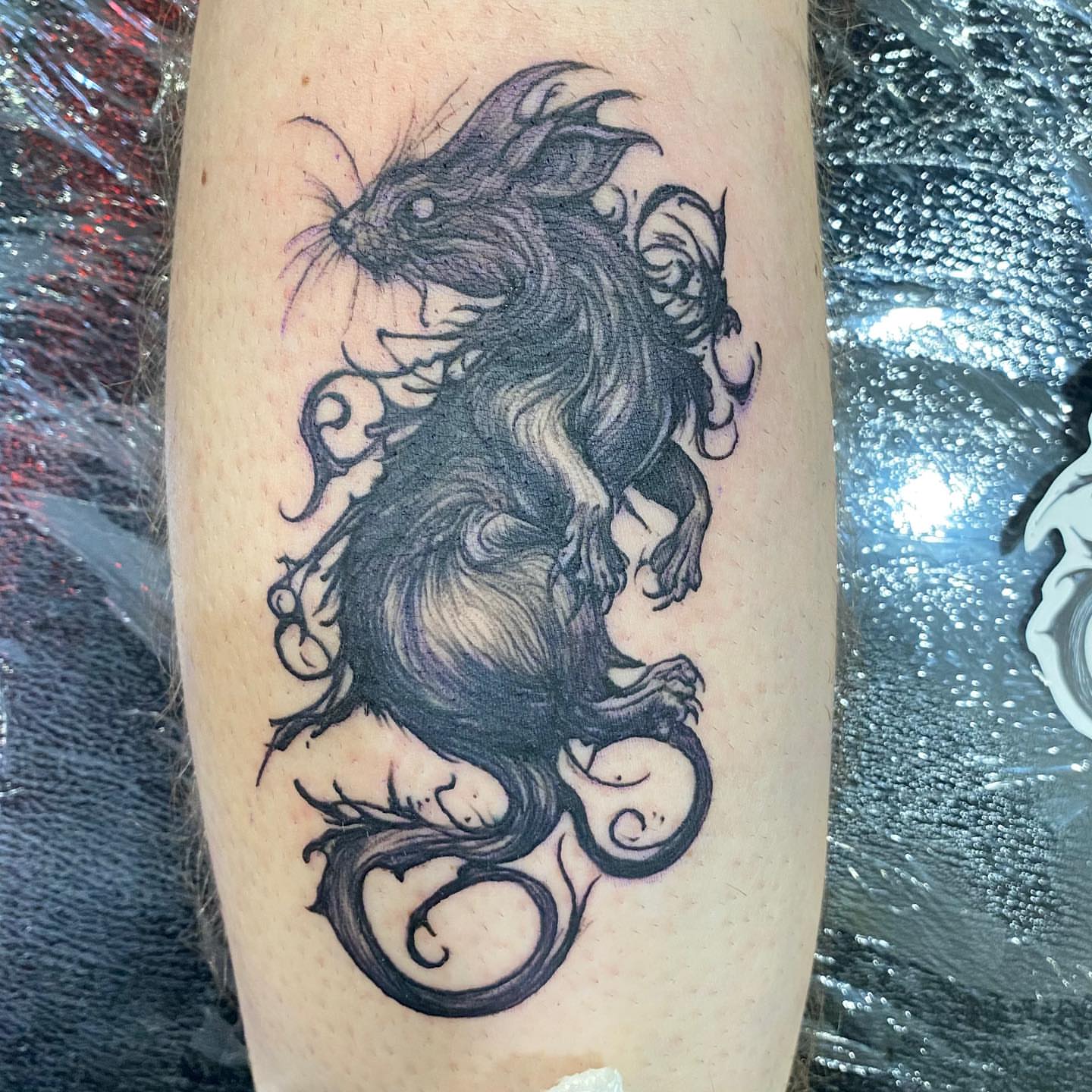Squirrel black and grey tattoo on the forearm by Hecho En El Bronx