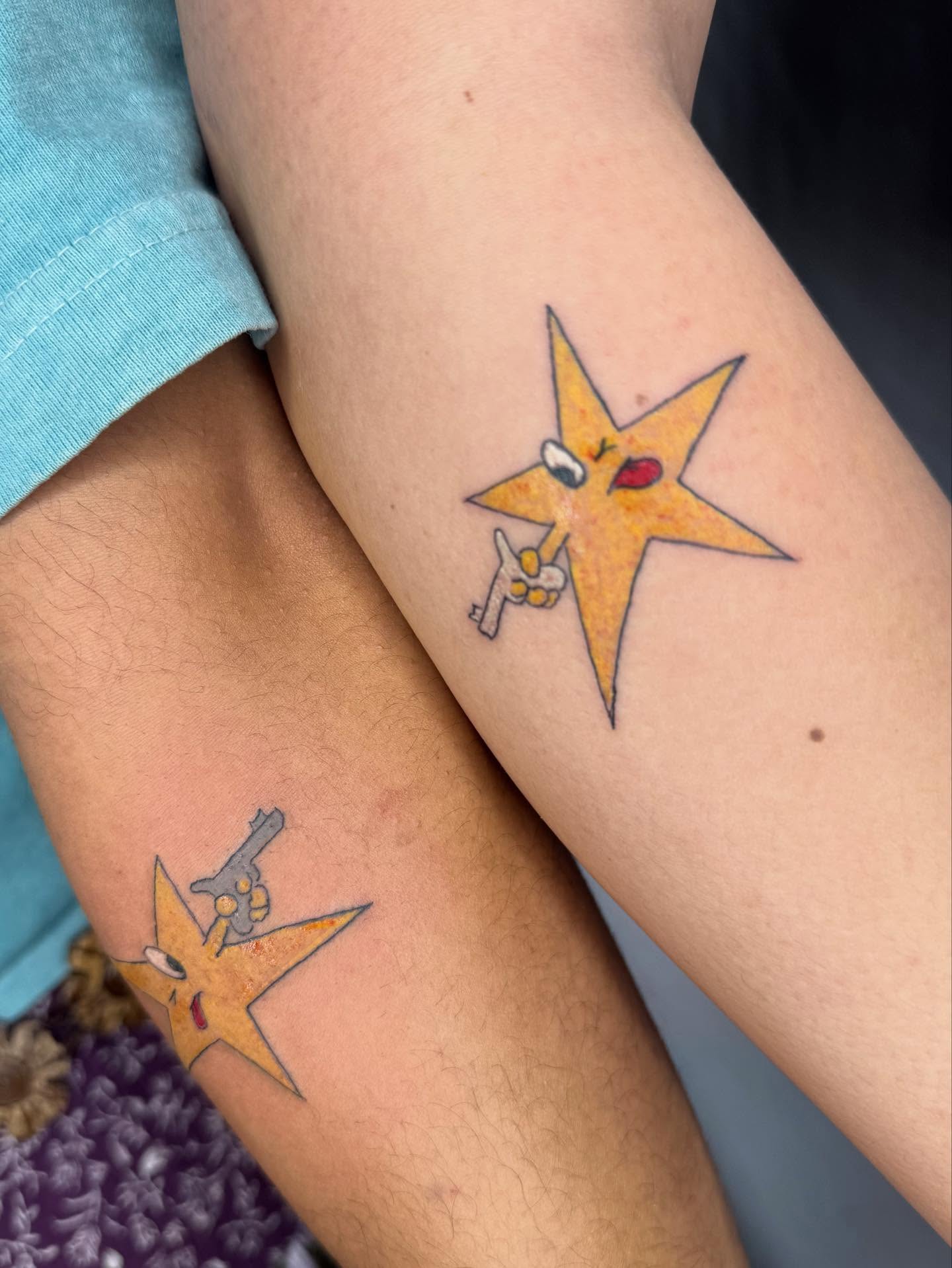 Star with gun neo-traditional tattoo on the forearm by @mr.smiley___