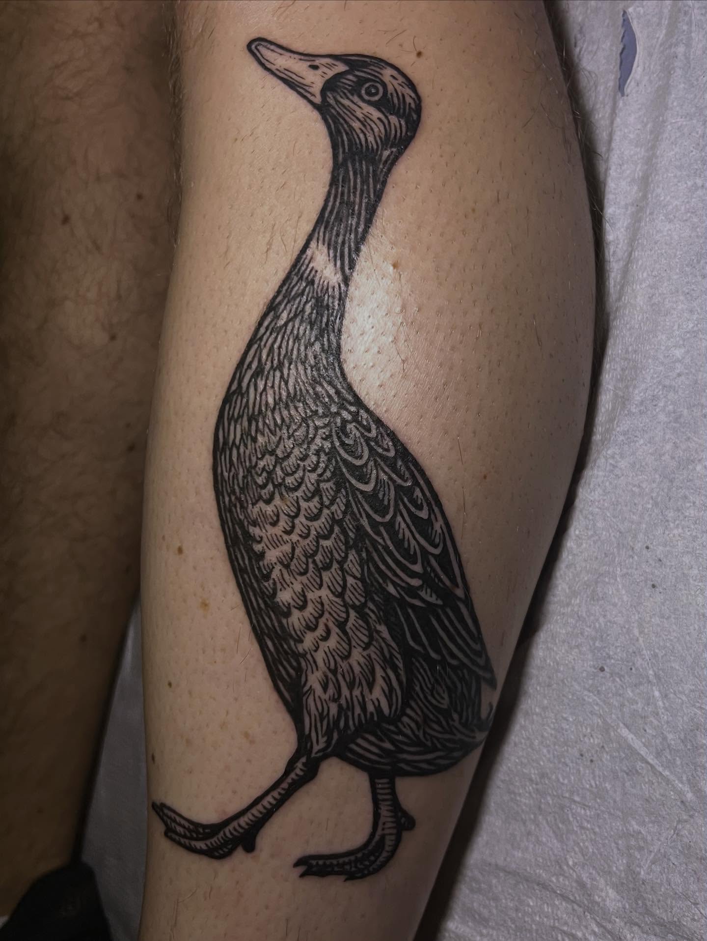 Duck black and grey tattoo on the forearm by Jason Middelton
