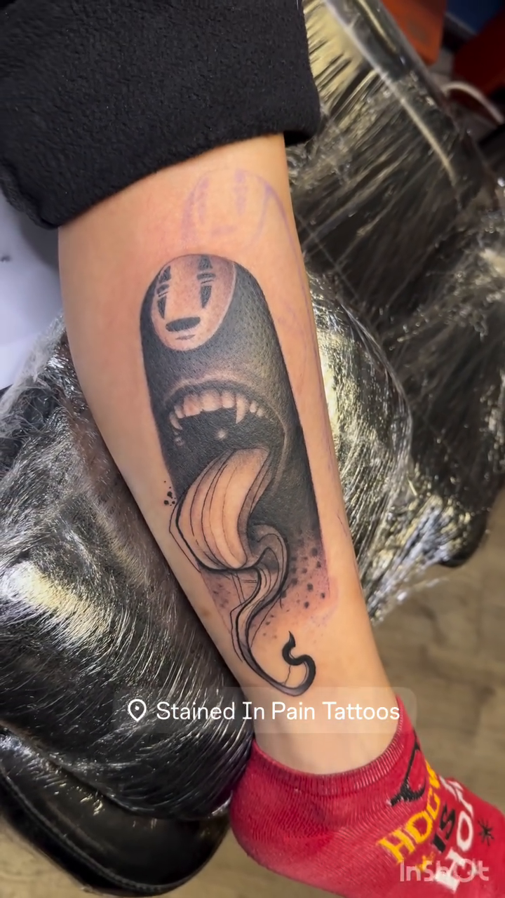 No-Face character with tongue out dark realism tattoo by Juan c munoz jr, Chicago, Illinois