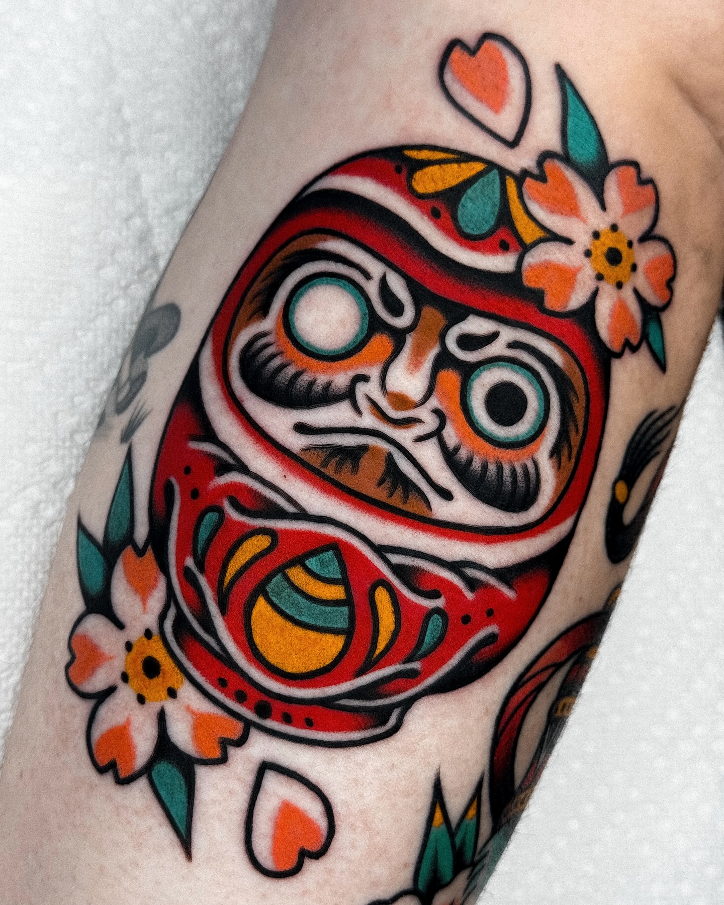 Demon mask American traditional tattoo on the forearm by Samuel Dickey