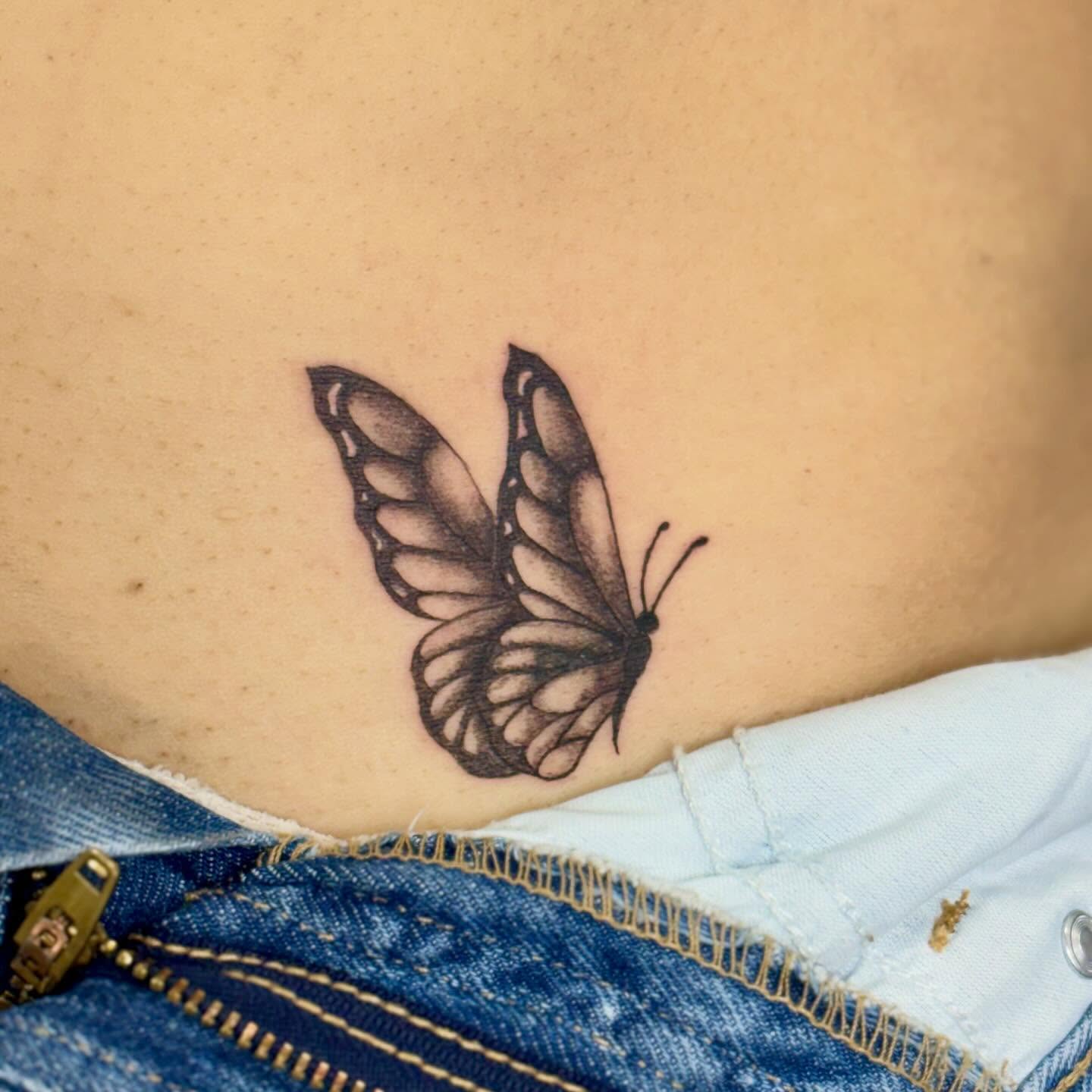 Butterfly black and grey tattoo on the ribs by bradyn thornton: eco-tattoo artist