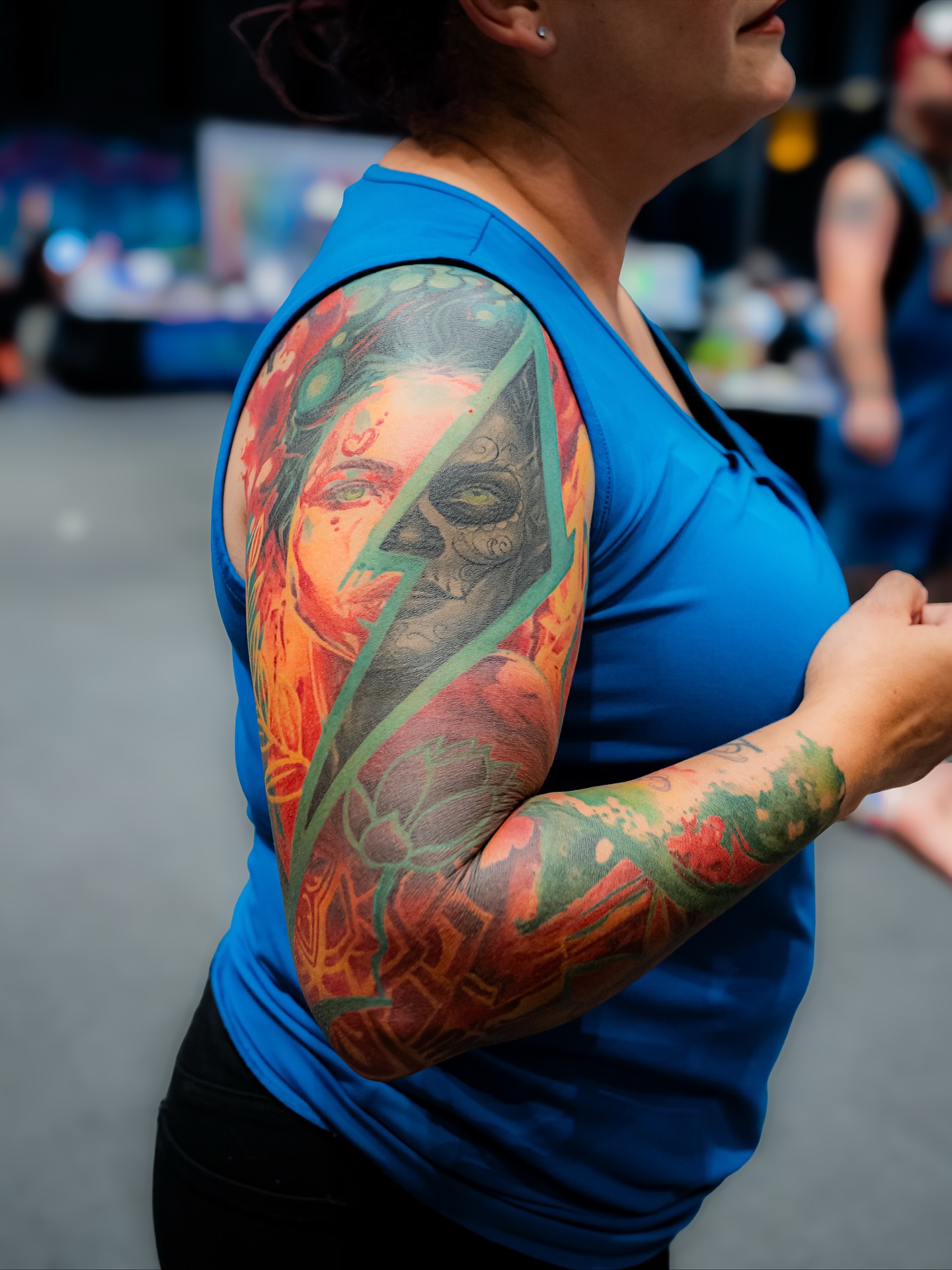 Woman with skull American traditional tattoo on the upper arm by TyEsha Reels
