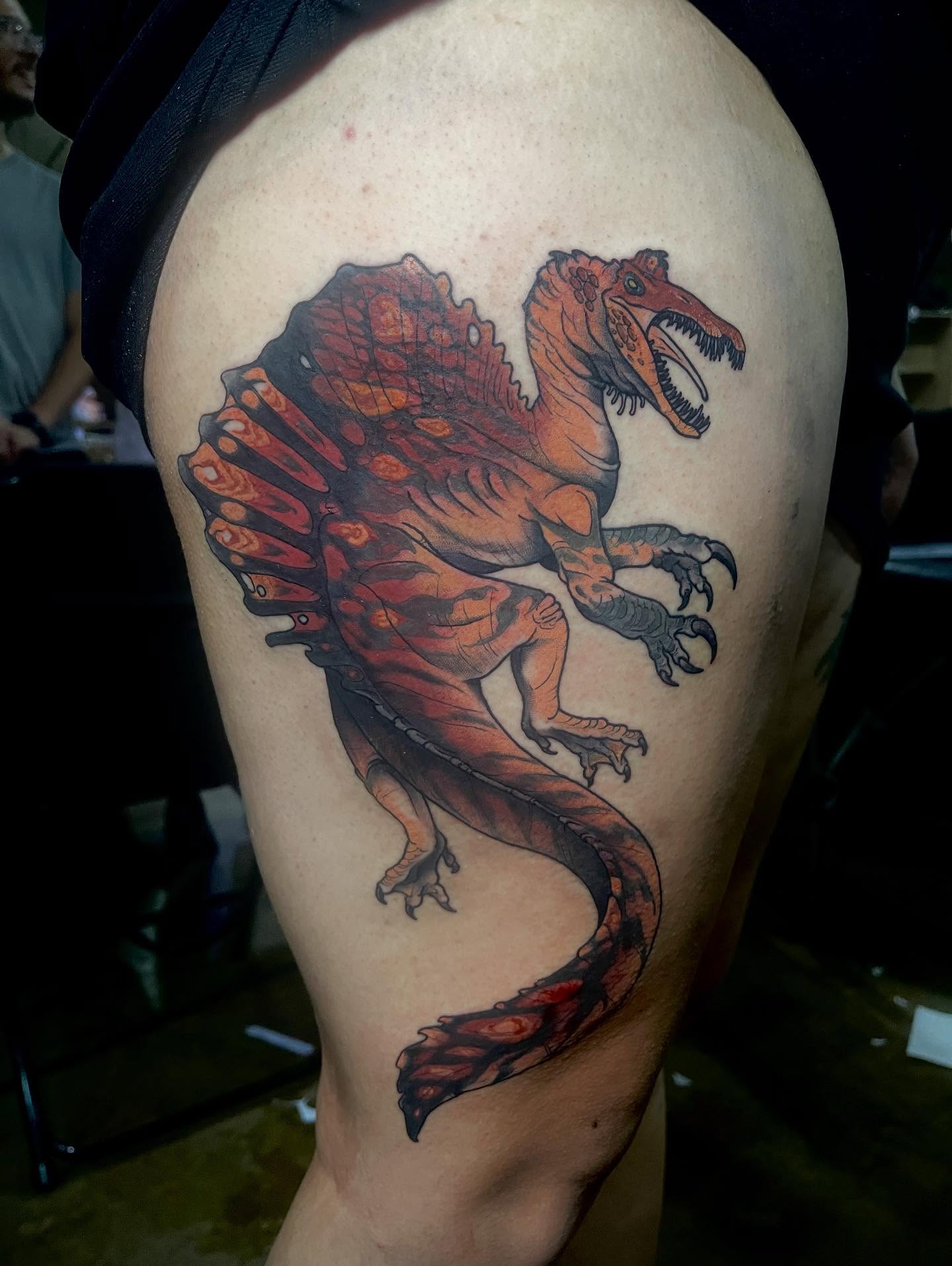 Dinosaur realism tattoo on the thigh by Joe Moreira