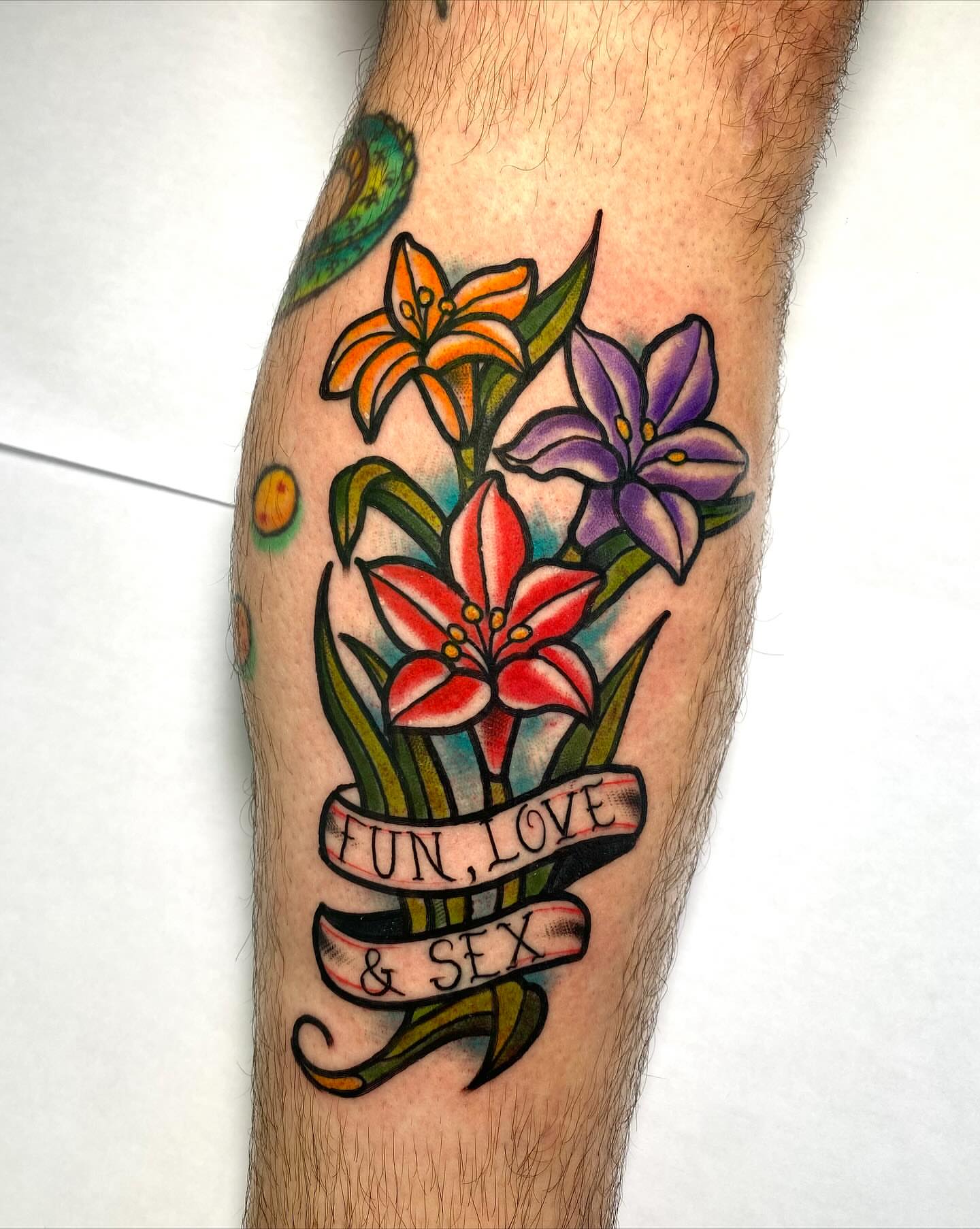 Flowers and banner American traditional tattoo on the forearm by ✶ 𝑺𝑰𝑳𝑽𝑨𝑵𝑨