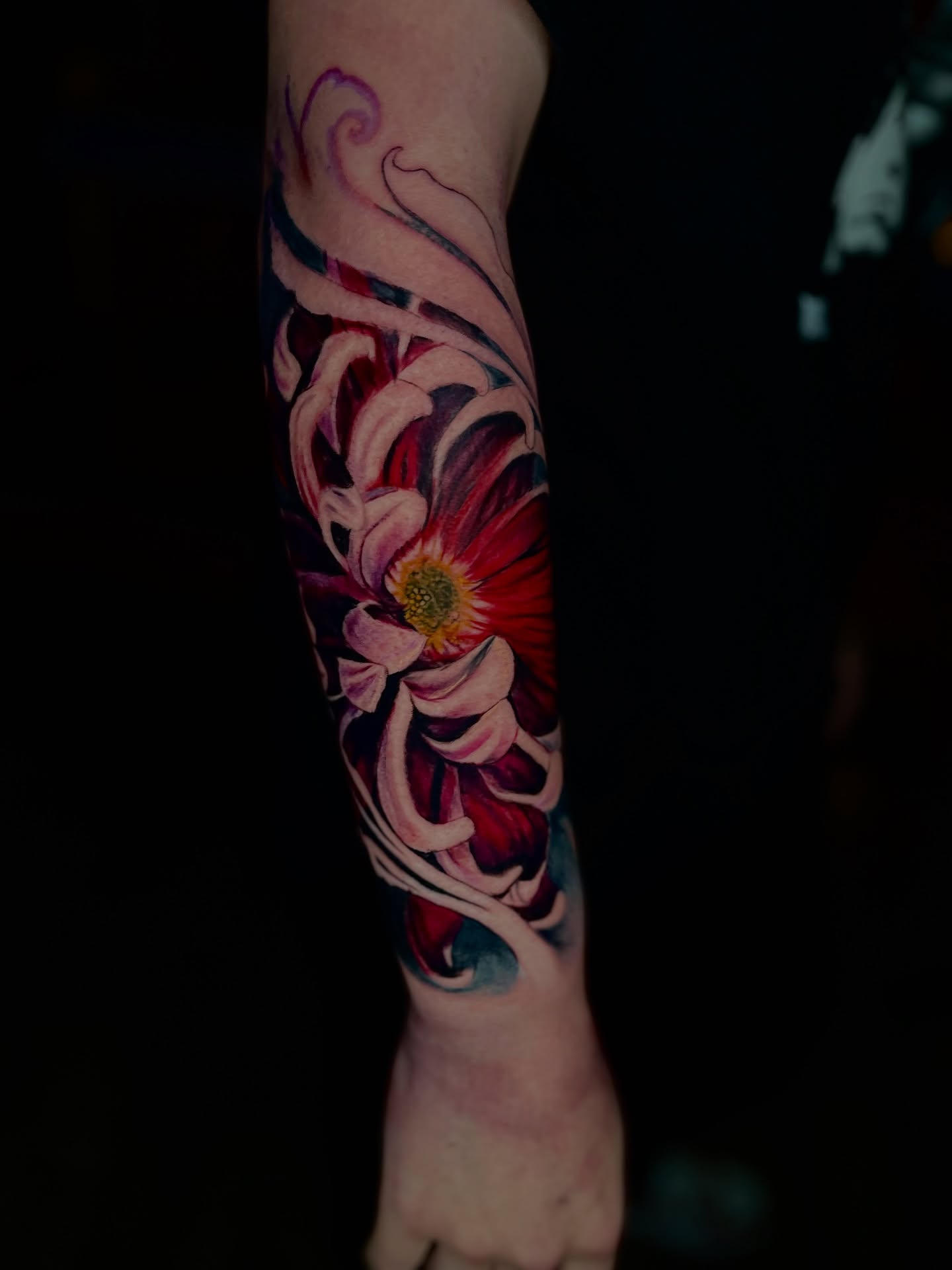Flower realism tattoo on the forearm by Dean Rogers