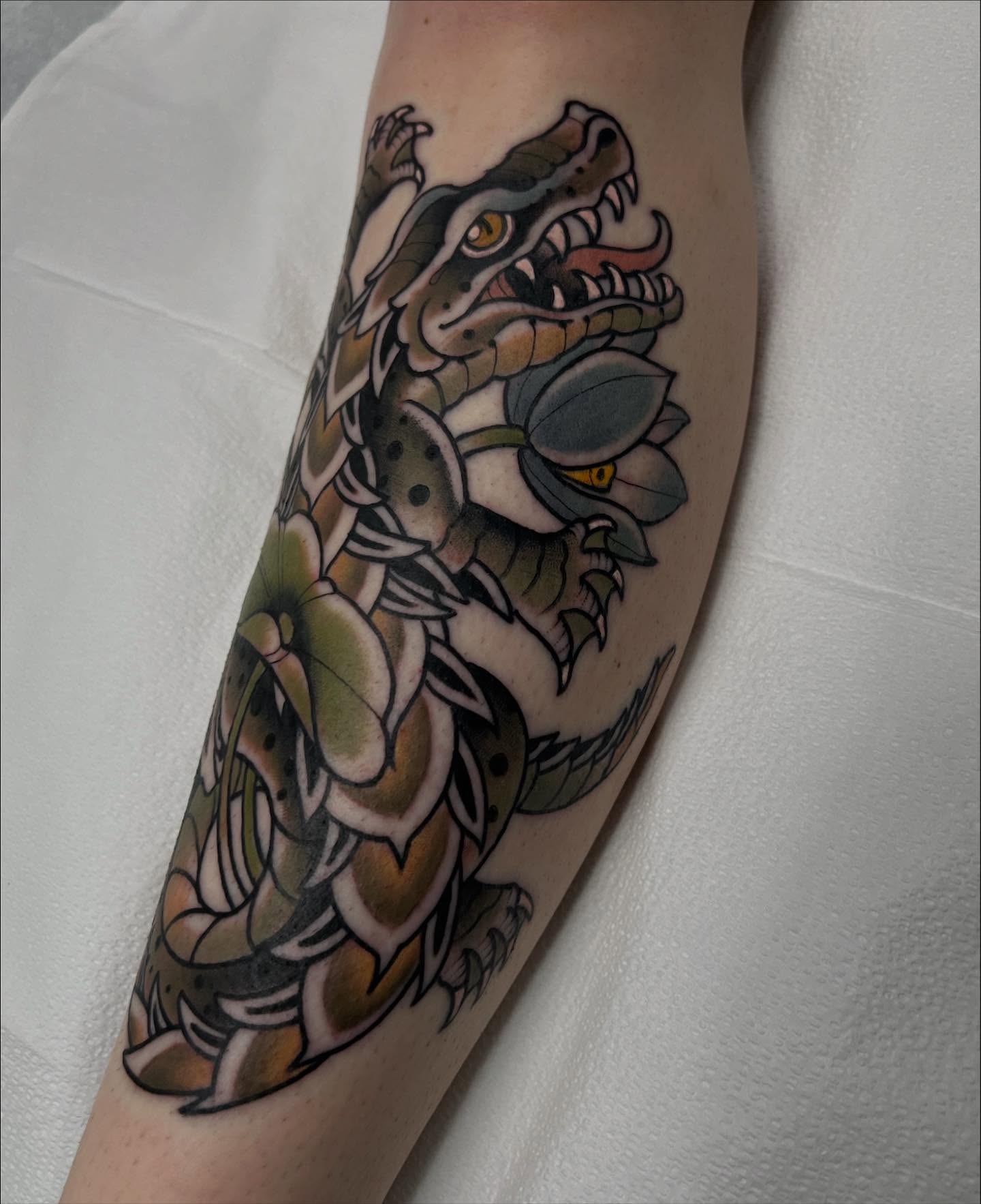 Snake and lotus American traditional tattoo on the forearm by Kyle Olson, Salt Lake City, Utah