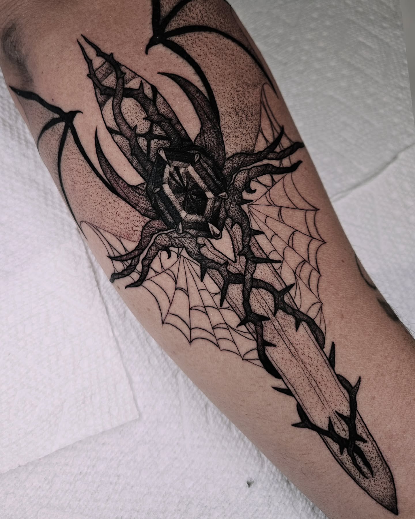 Spider dotwork tattoo on the forearm by Sabrina Wagner