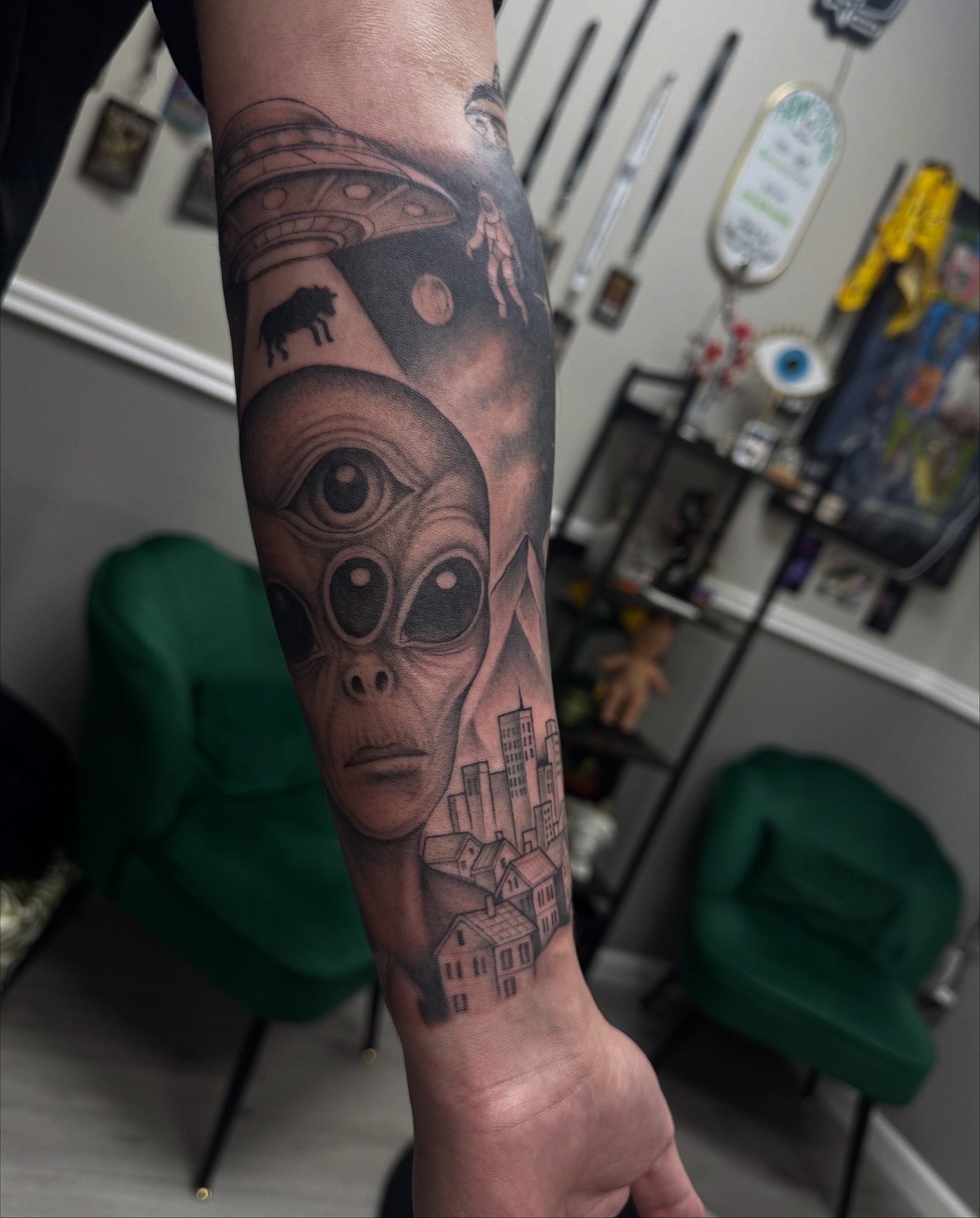 Alien head realism tattoo on the forearm by Mo Dinero🎰