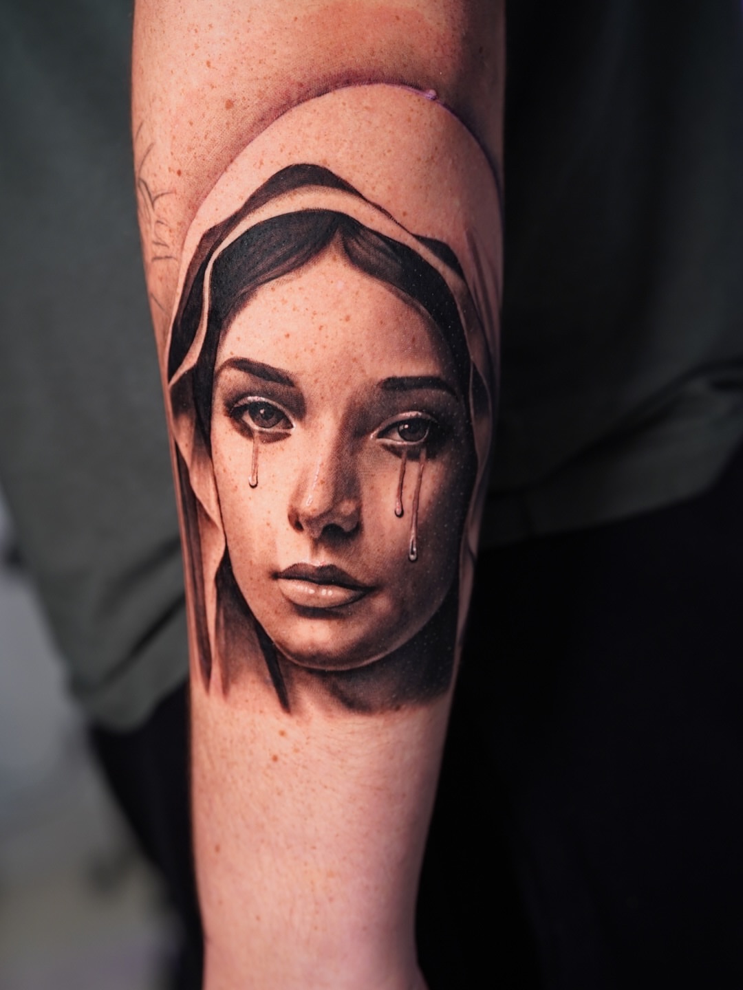 Woman's face realism tattoo on the forearm by Luis Rodriguez