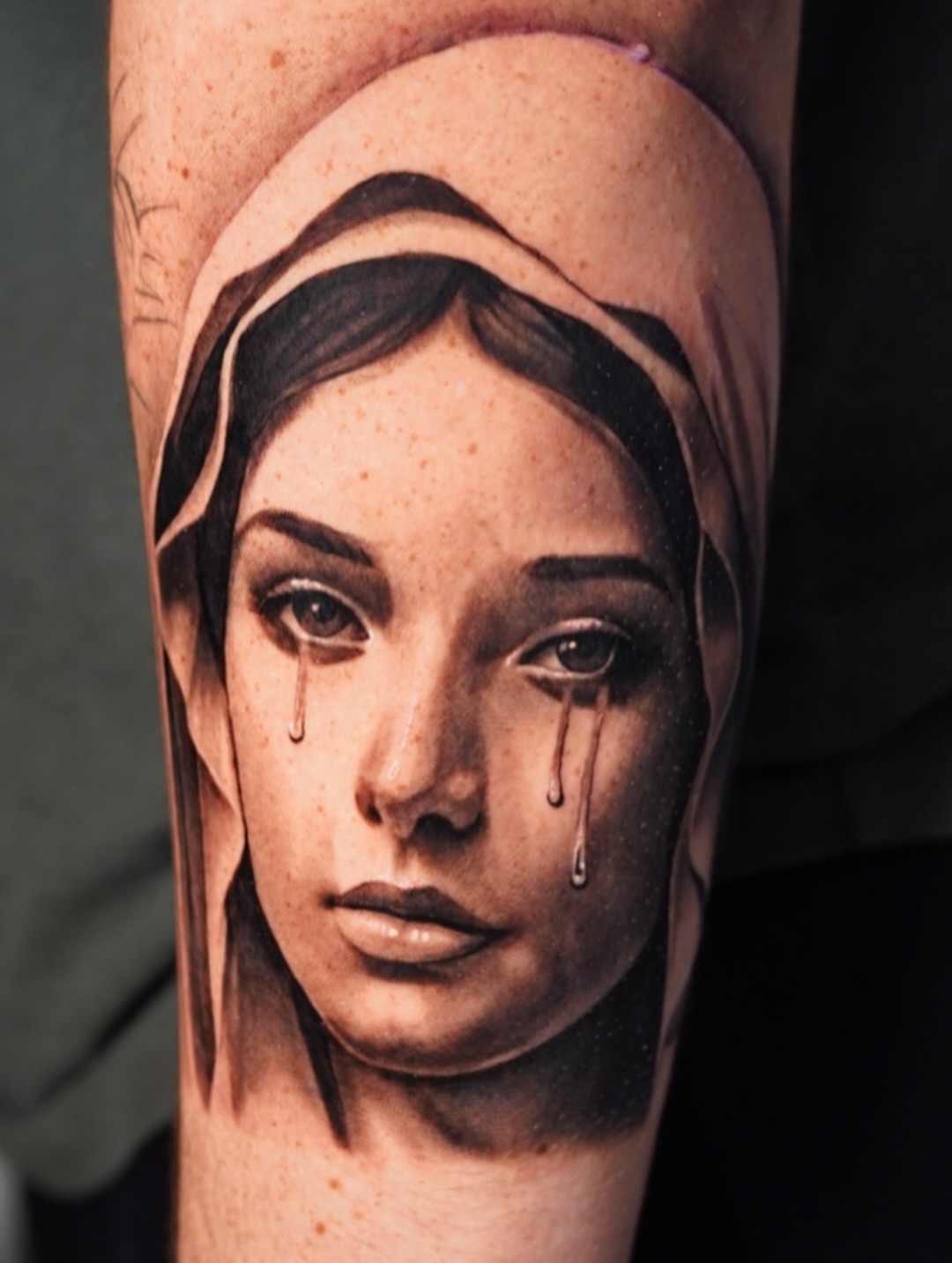Woman's face realism tattoo on the forearm by Luis Rodriguez