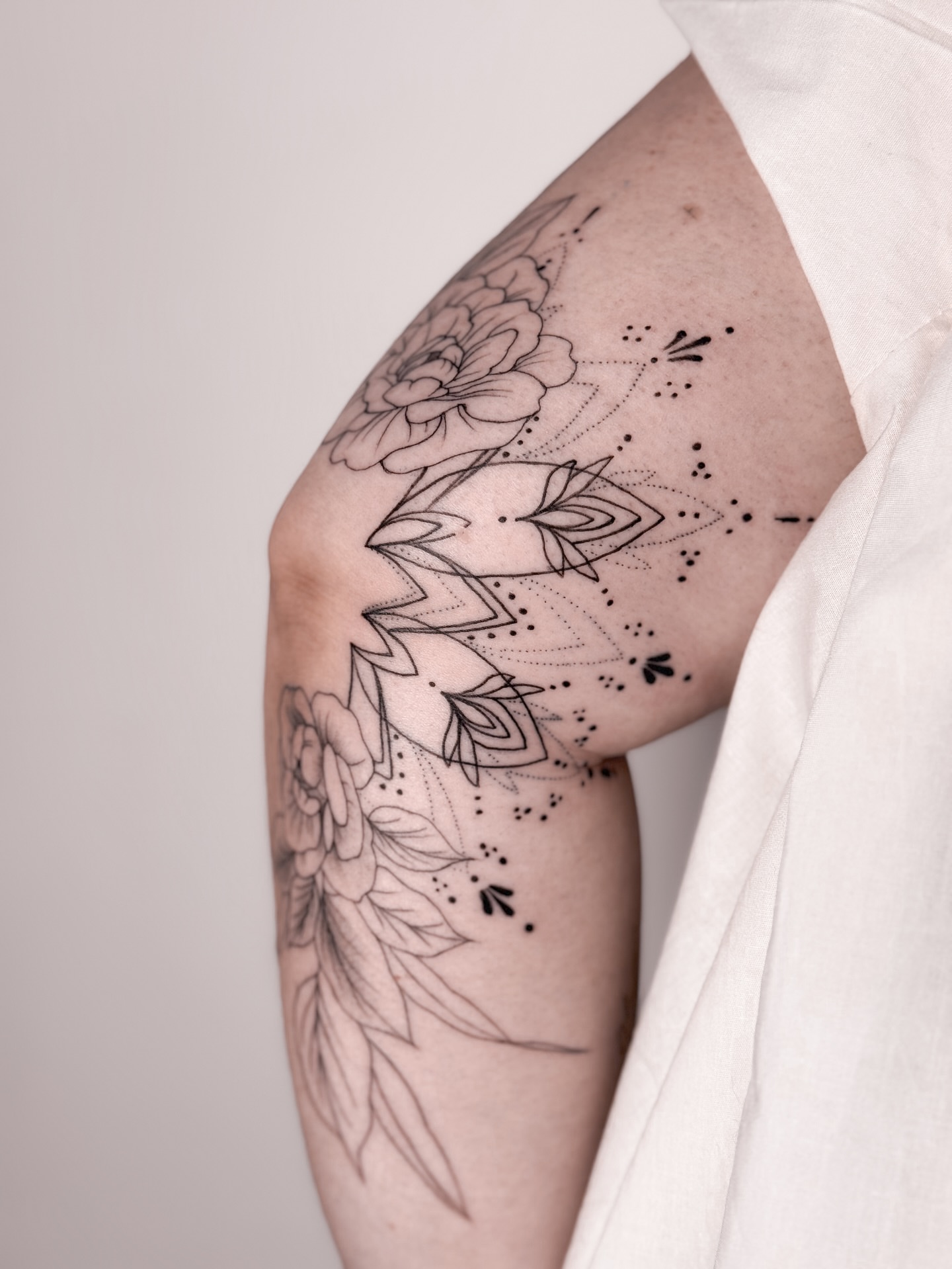 Tattoo by @romanova.skinart — dotwork, geometric