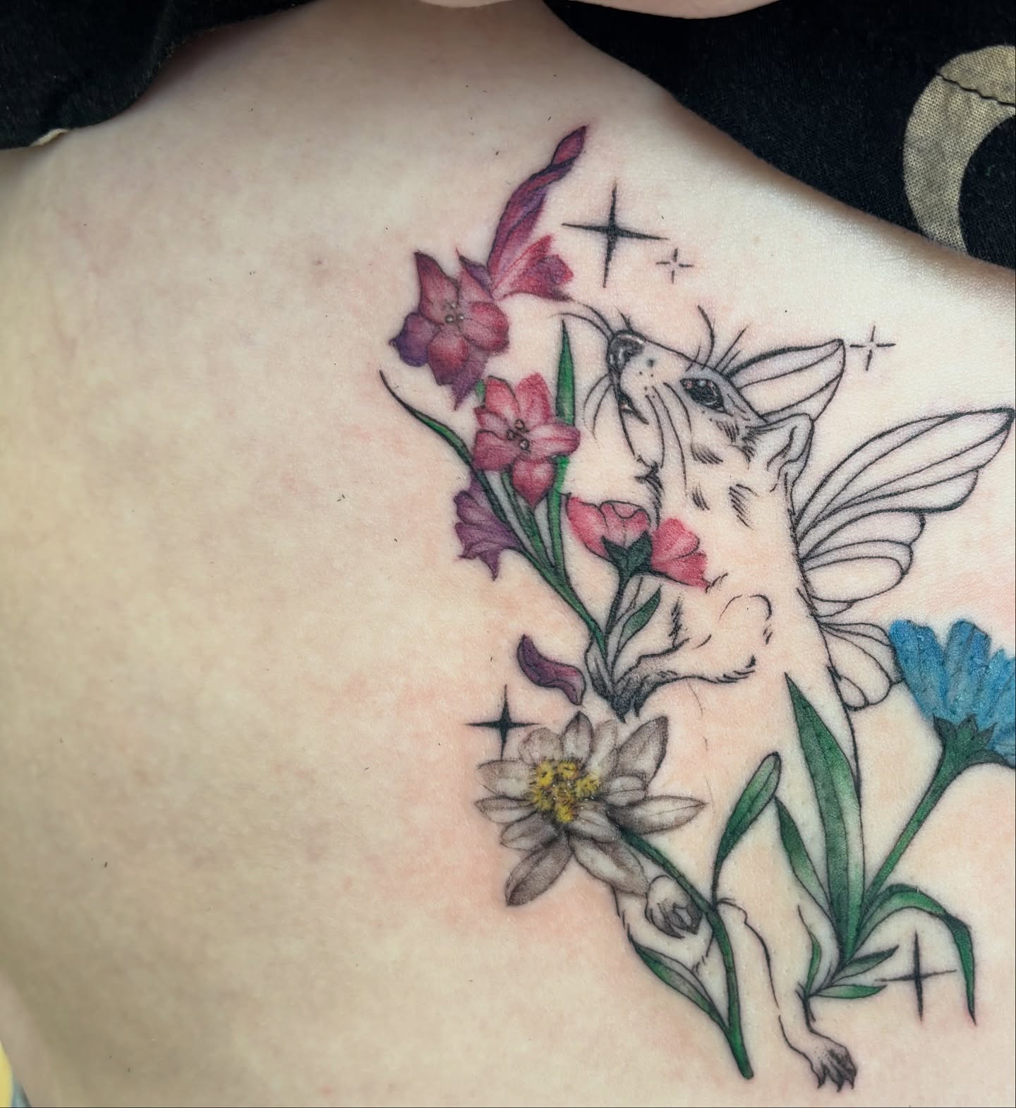 Fairy with flowers new school tattoo on the back by Ivanna