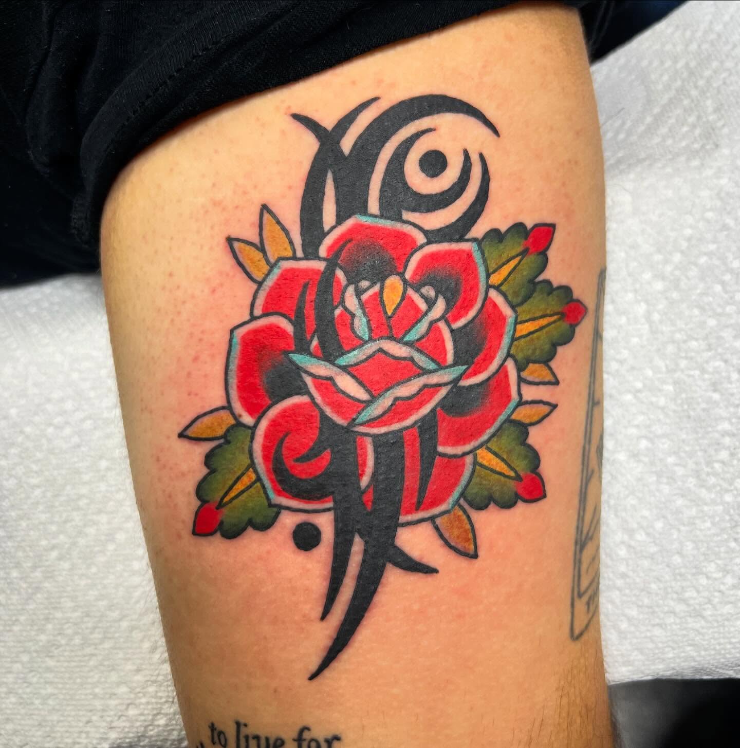 Rose American traditional tattoo on the thigh by Taylor Estrella