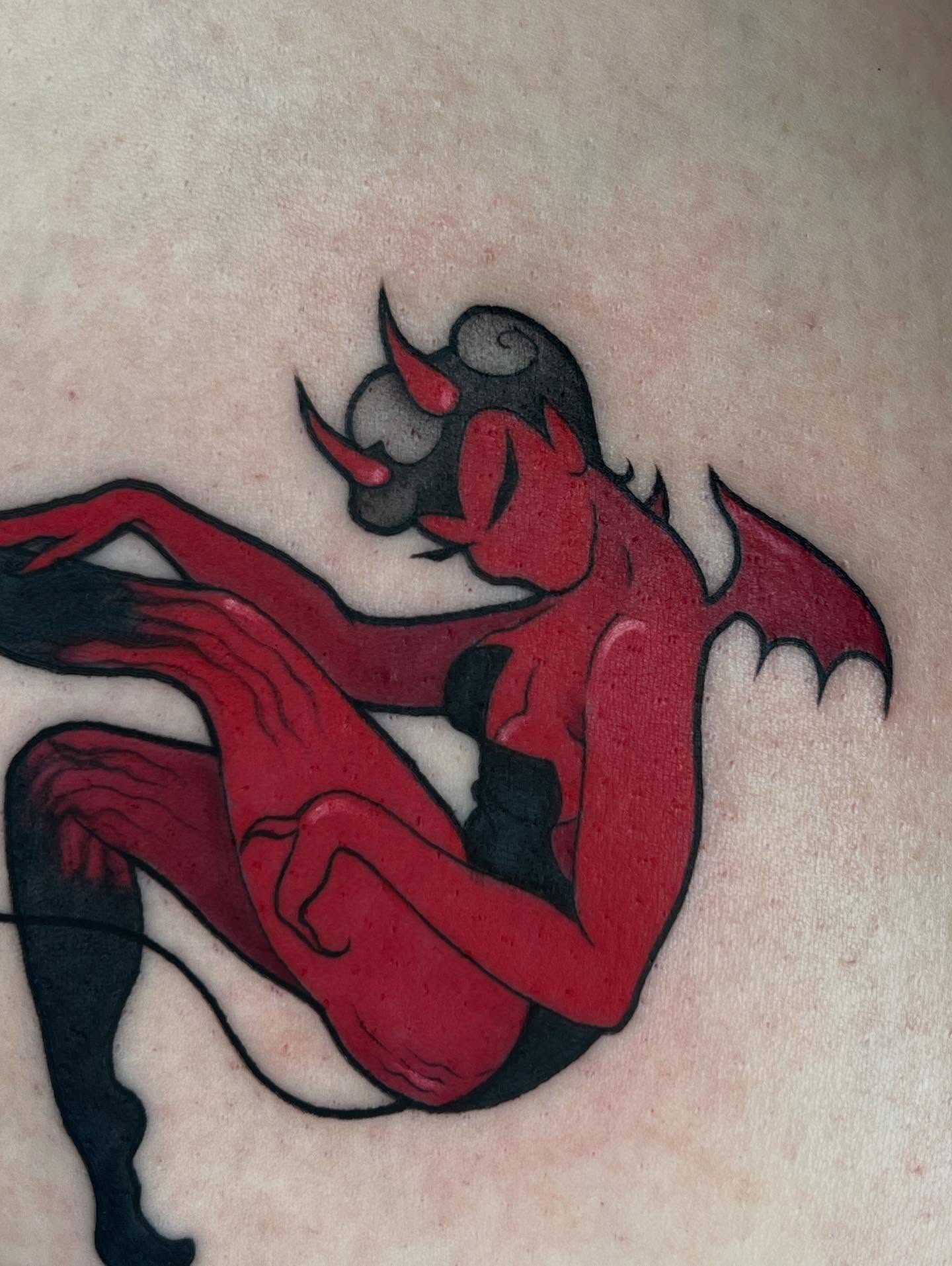 Red devil American traditional tattoo on the torso by Severin Black