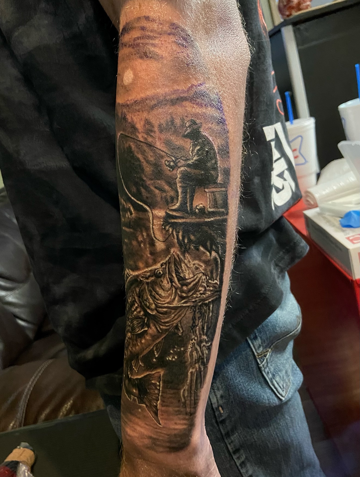 Fishing scene realism tattoo on the forearm by Colt