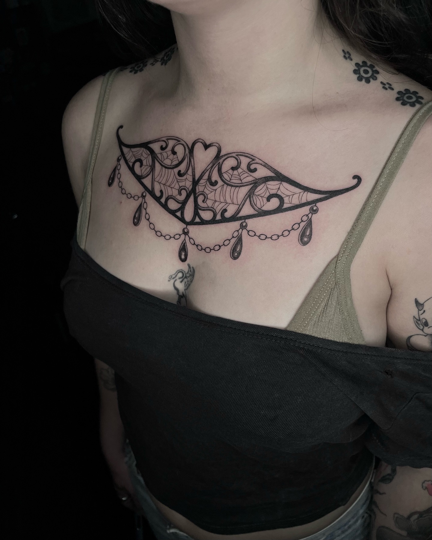 Wing with heart ornamental tattoo on the chest by Tattoo Artist, in San Francisco, CA