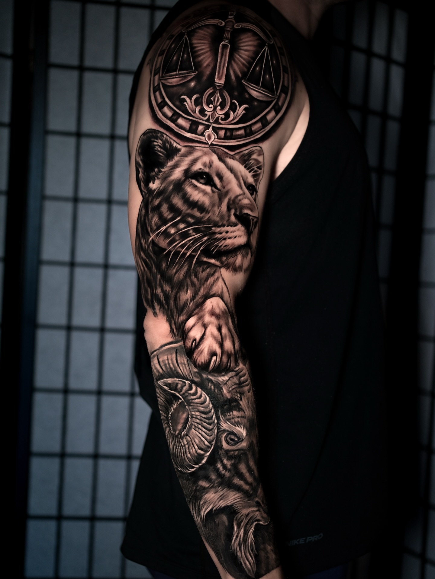 Tiger and scales realism tattoo on the forearm by Juan David Arias