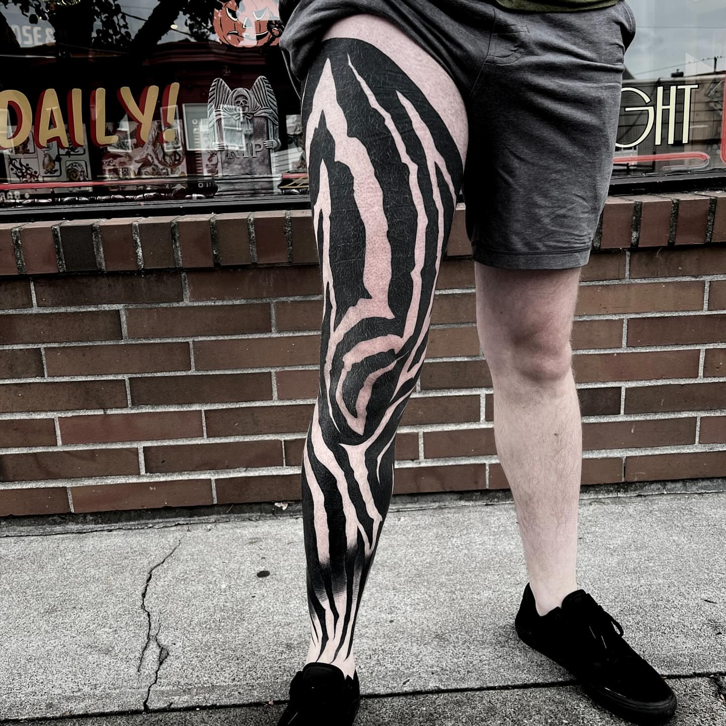 Zebra stripes black and grey tattoo on the thigh by Jon Crook, Portland, Oregon