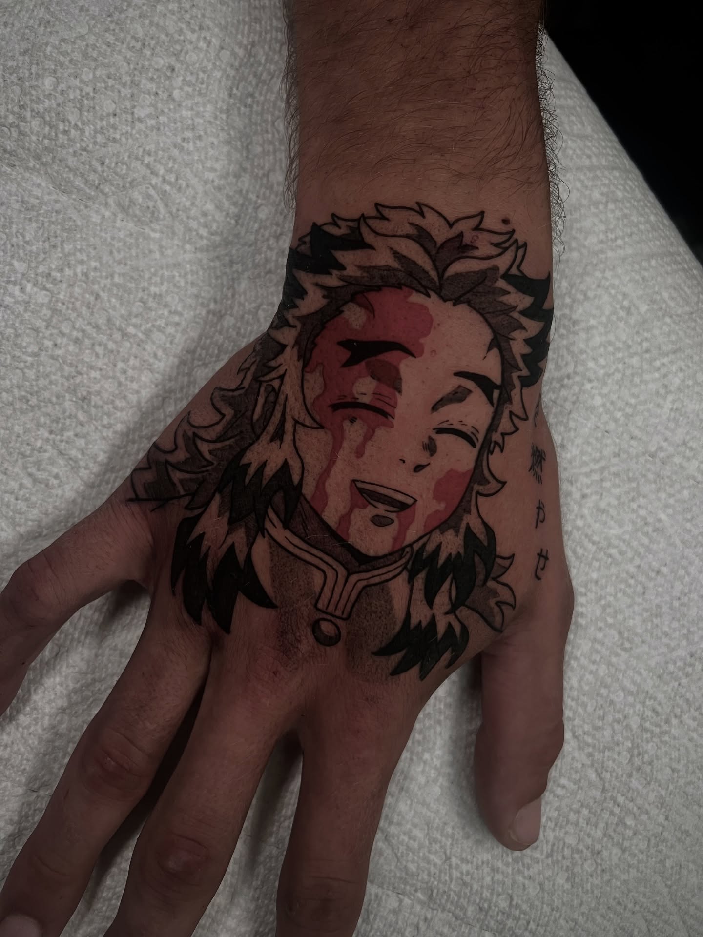 Anime character anime tattoo on the hand by Chandler Roe