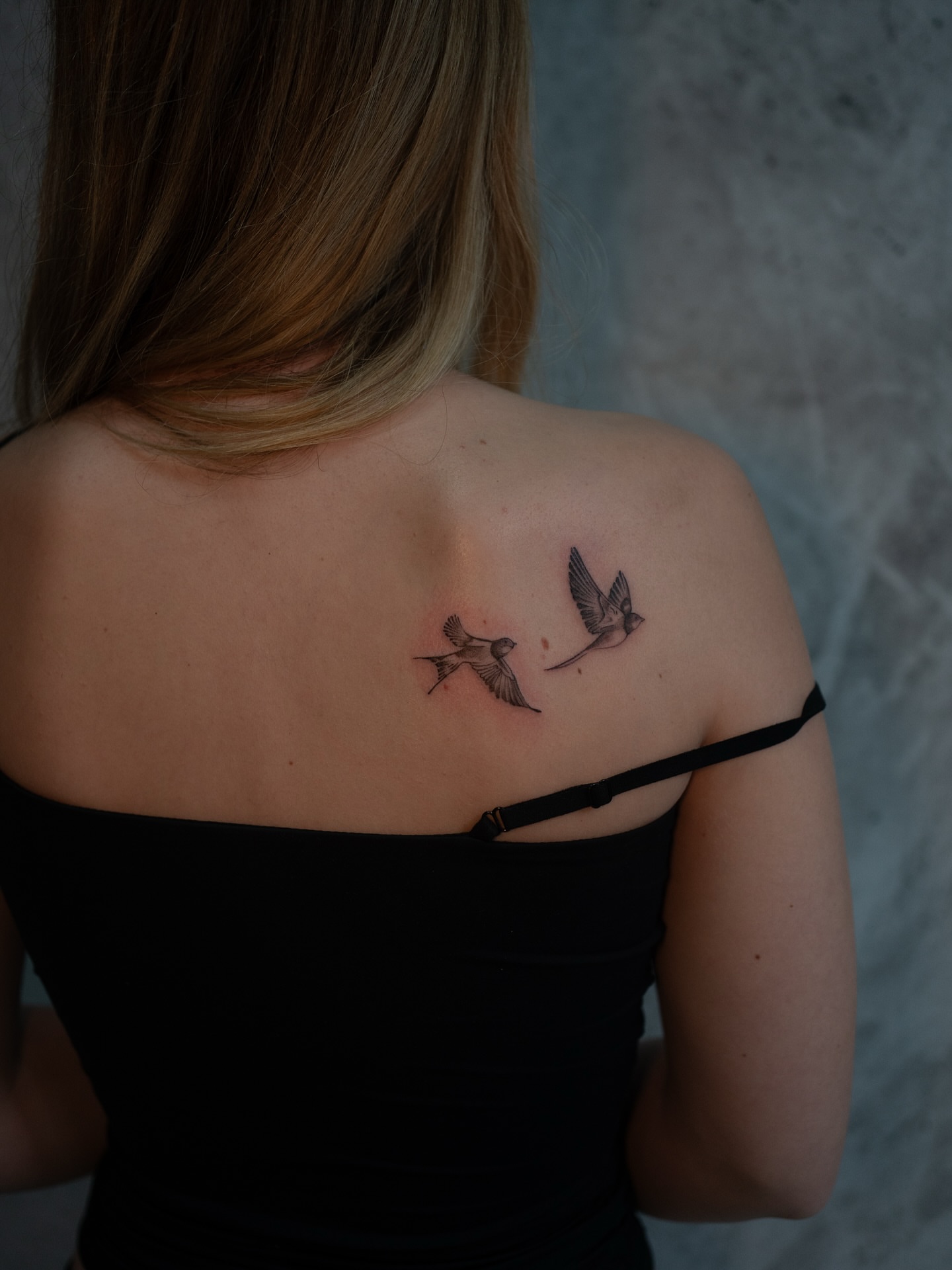 Birds black and grey tattoo on the shoulder by Damon Valdez