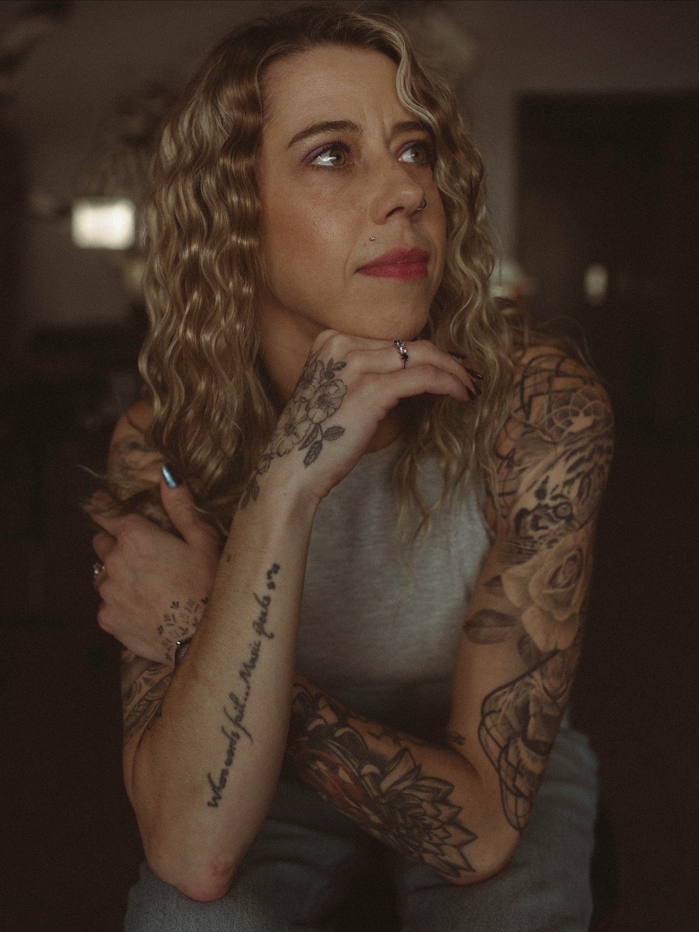 Floral black and grey tattoo on the upper arm by Jonathan Red