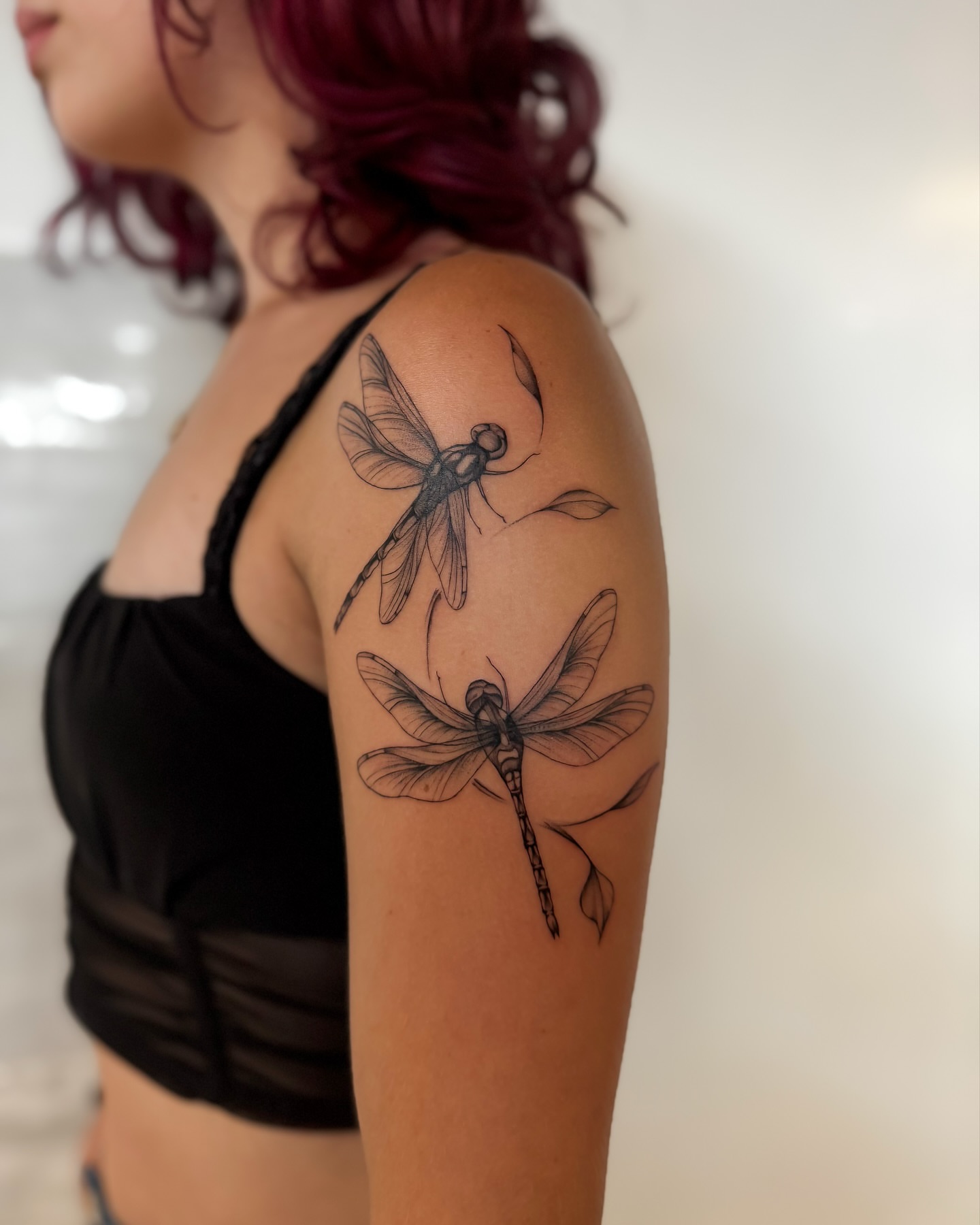Dragonfly black and grey tattoo on the shoulder by Amelia