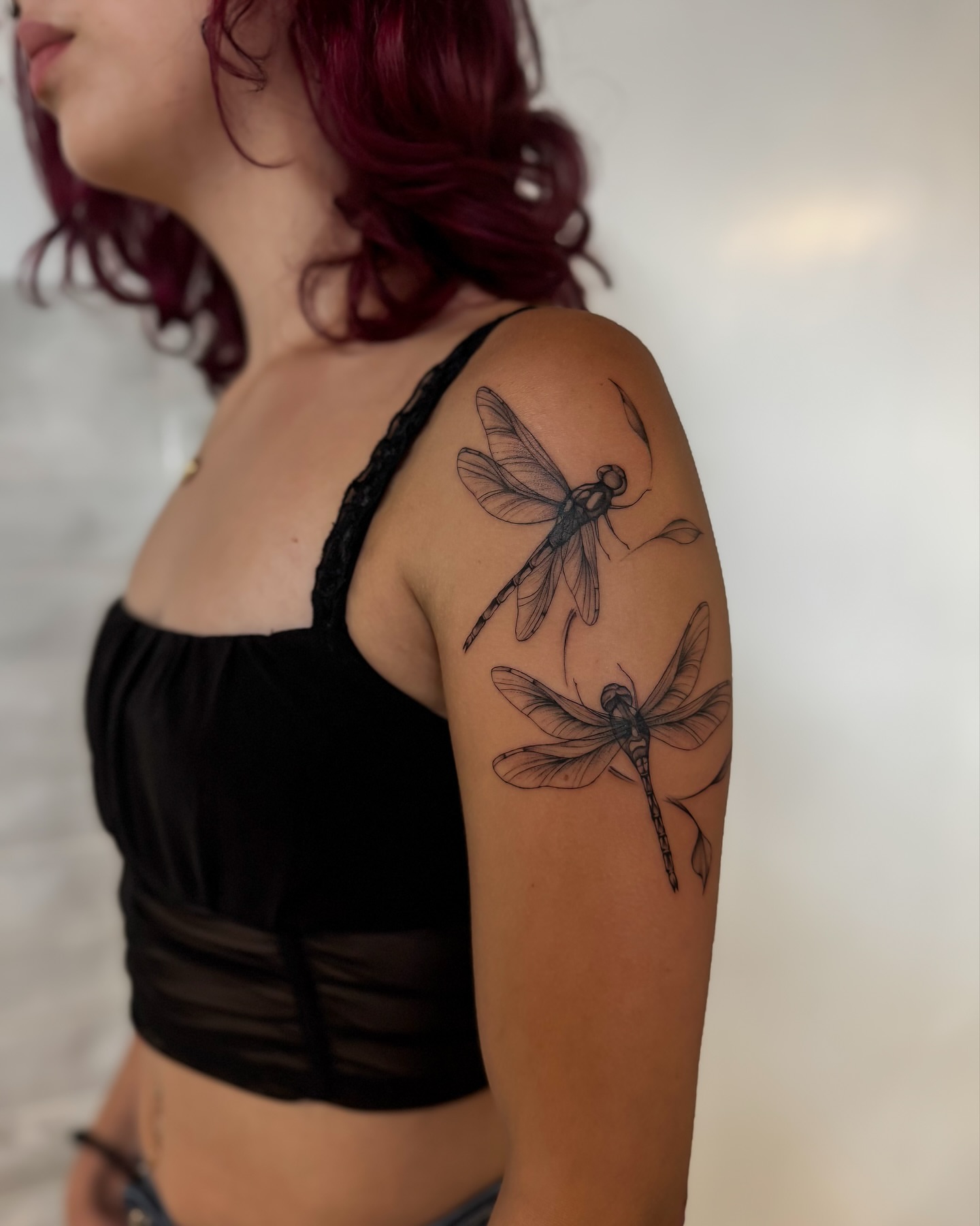 Dragonfly black and grey tattoo on the shoulder by Amelia