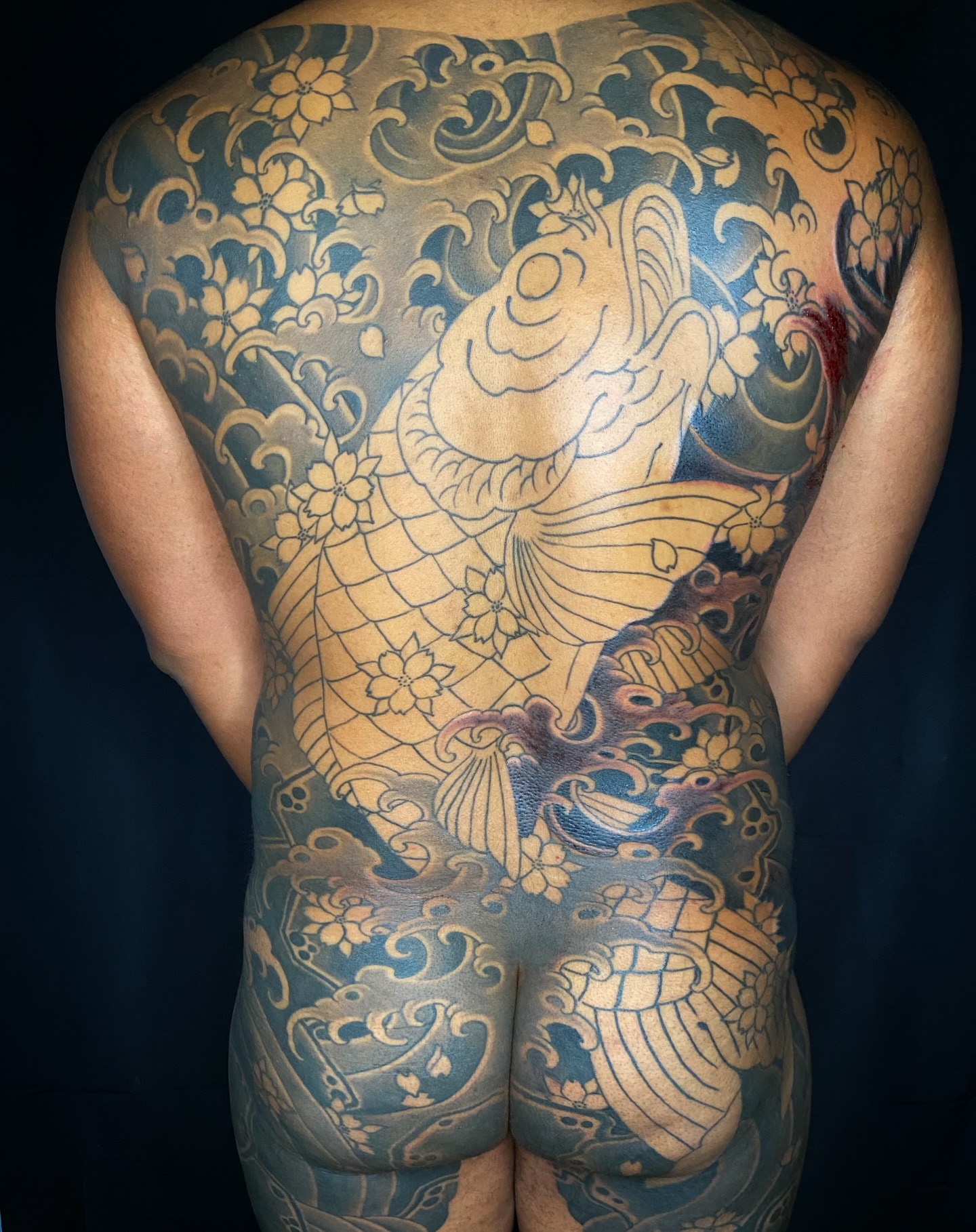 Koi fish japanese irezumi tattoo on the back by Leif Hansen
