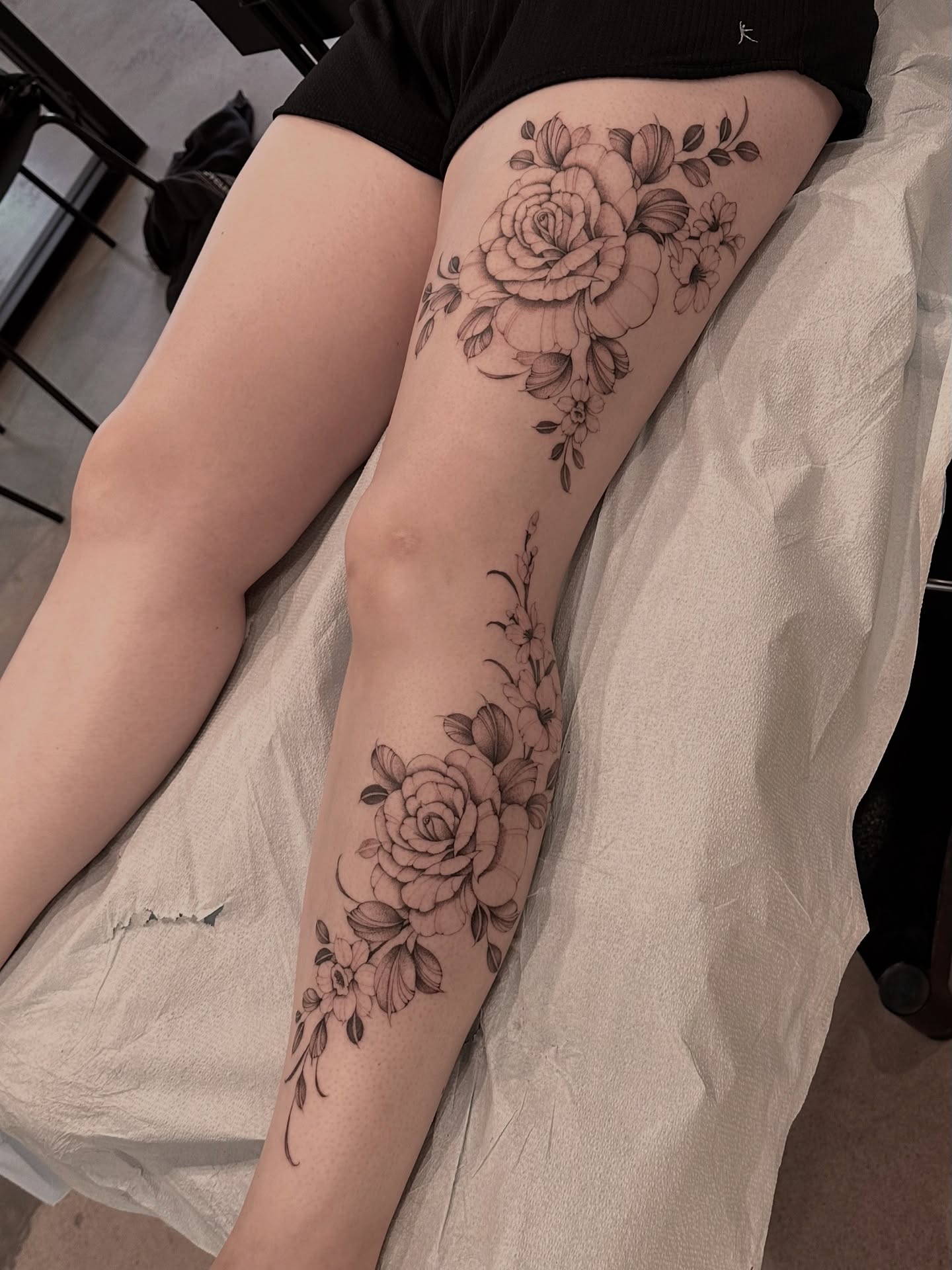 Floral bouquet black and grey tattoo on the thigh by ᴍɪᴄʜᴇʟʟᴇ, New York, New York