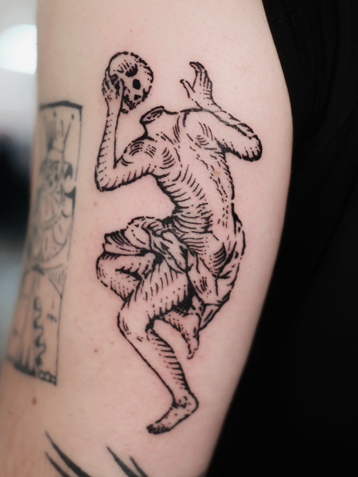 Dancing figure black and grey tattoo on the forearm by ꜰʟᴏʀᴀ ᴡᴏᴏᴅᴄᴜᴛ ᴛᴀᴛᴛᴏᴏ