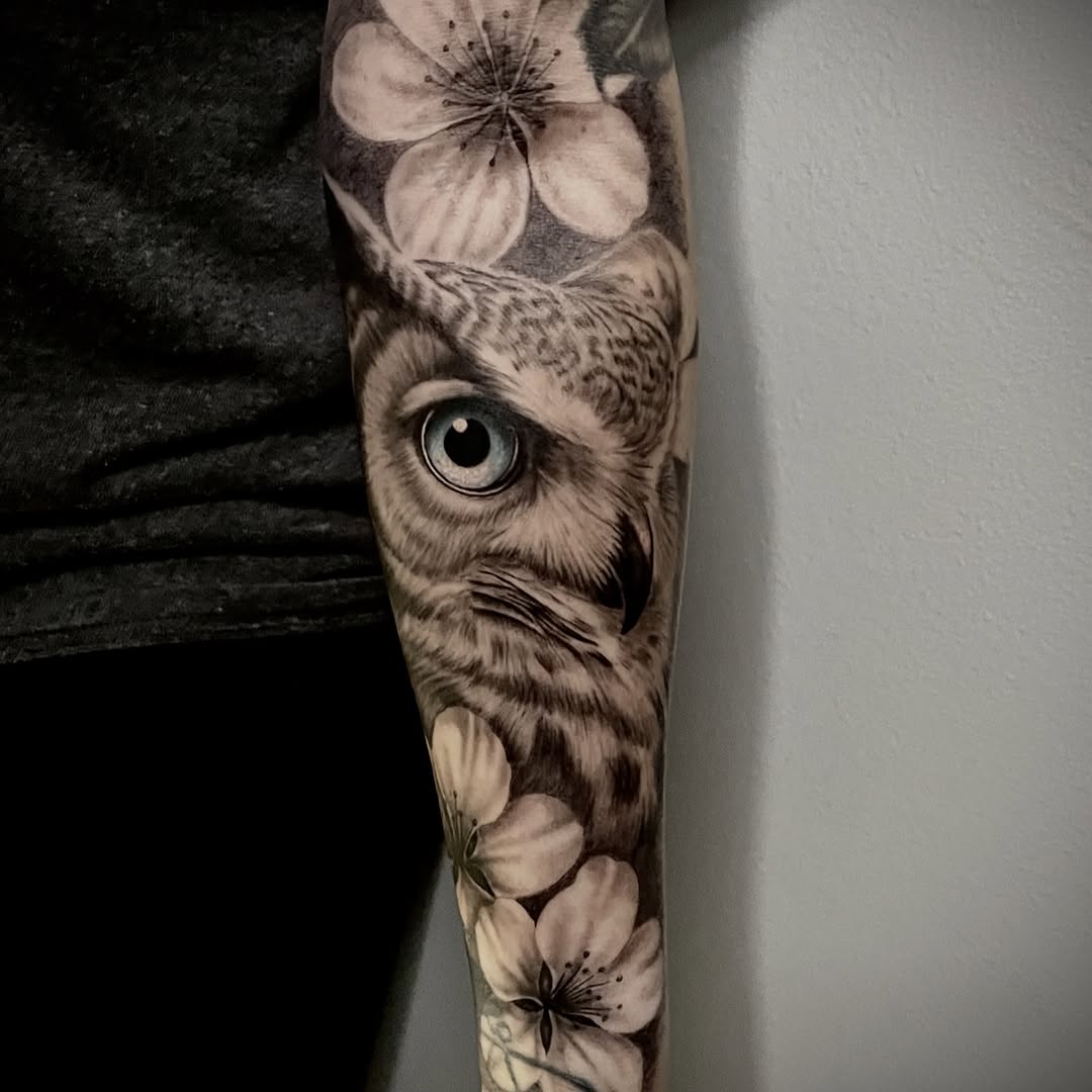 Owl and flowers fine line tattoo on the forearm by Charlie