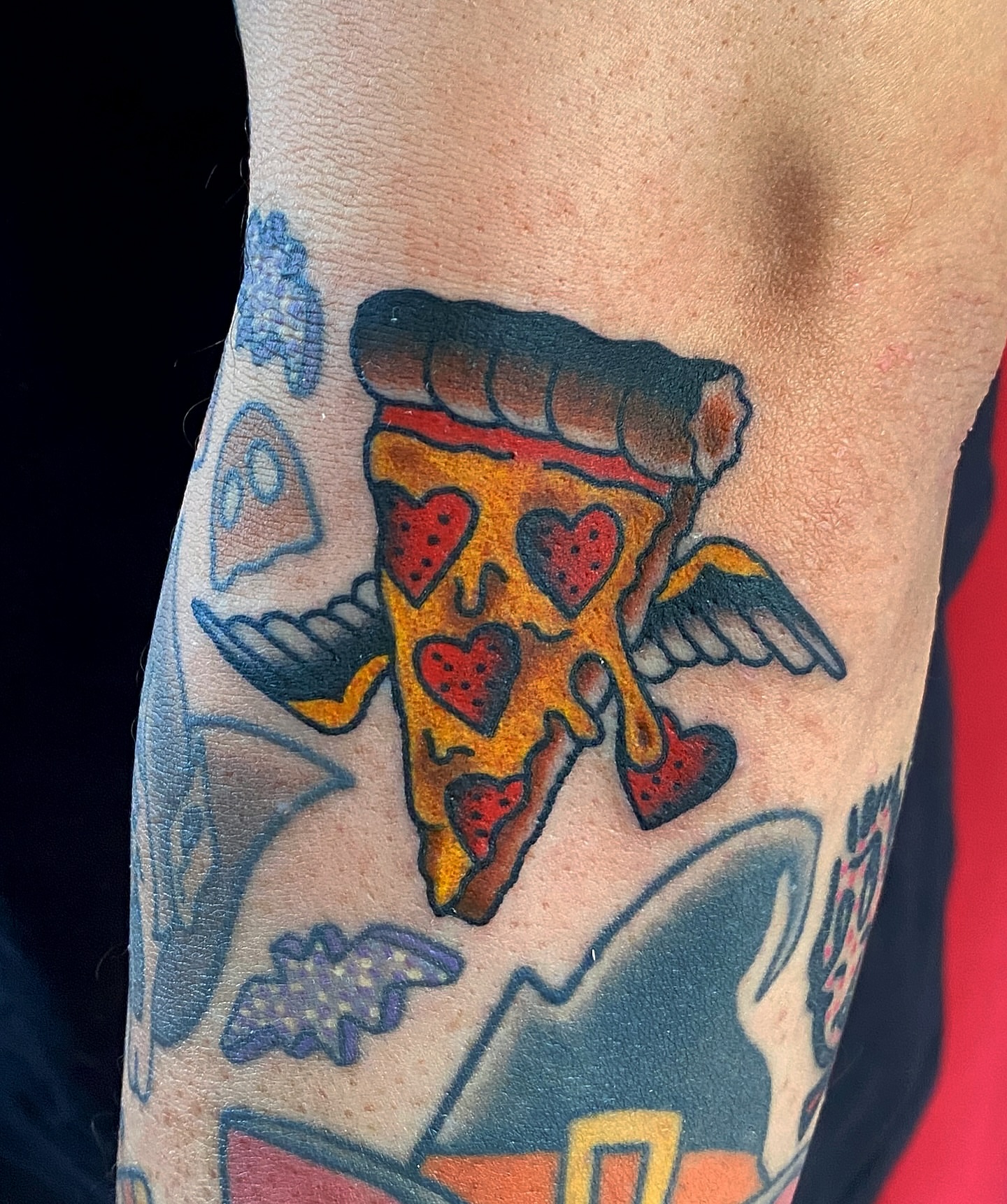 Pizza slice American traditional tattoo on the forearm by atomlenhart, Lancaster, Pennsylvania