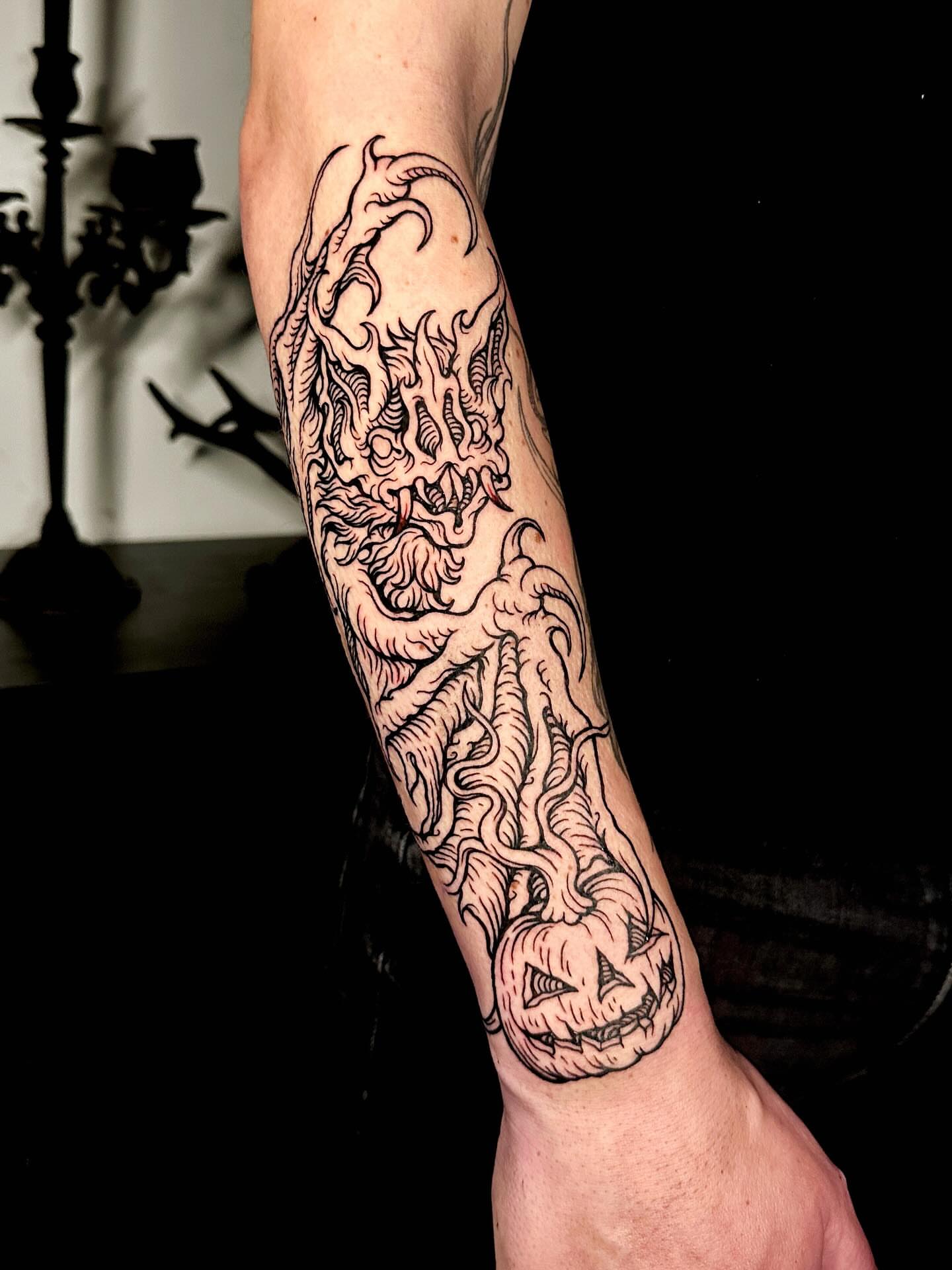 Jack-o'-lantern black and grey tattoo on the forearm by 𝕾𝖆𝖘𝖍𝖆 𝖂𝖔𝖑𝖆𝖓𝖉
