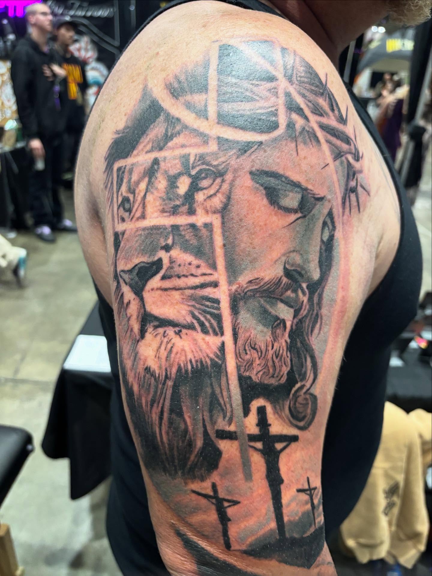 Religious figure realism tattoo on the shoulder by Dre Ortiz