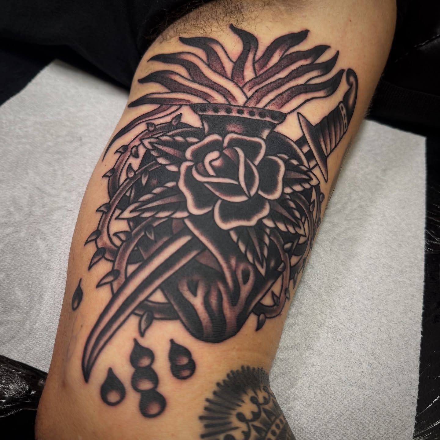 Rose and dagger realism tattoo on the forearm by Rogelio Robles