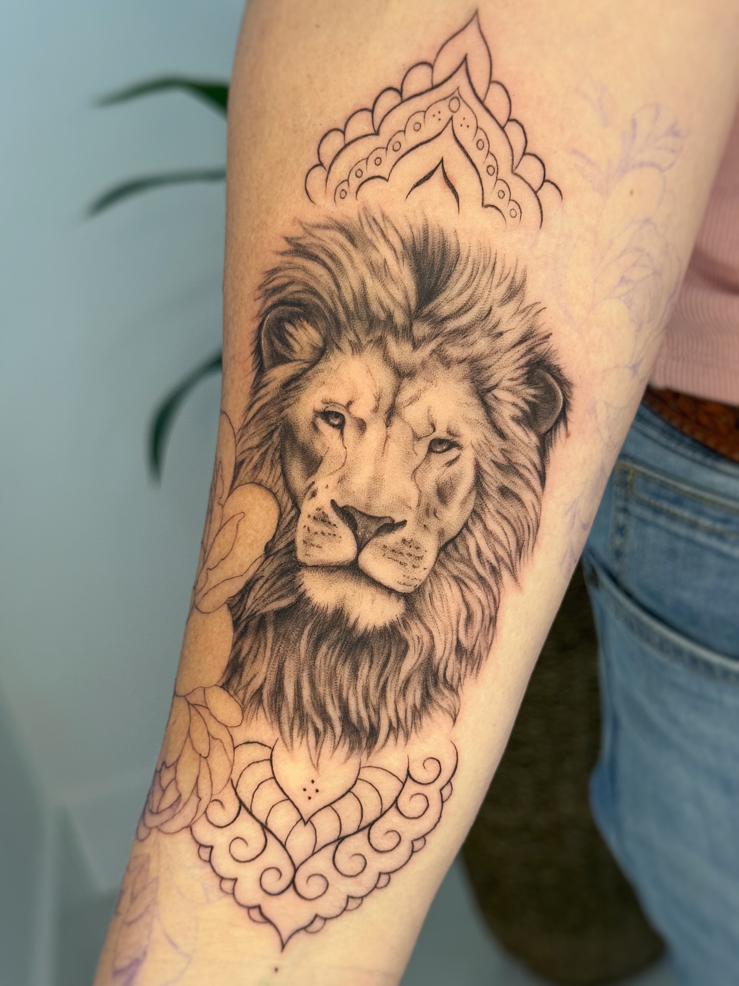 Lion realism tattoo on the forearm by Gianna Rodriguez