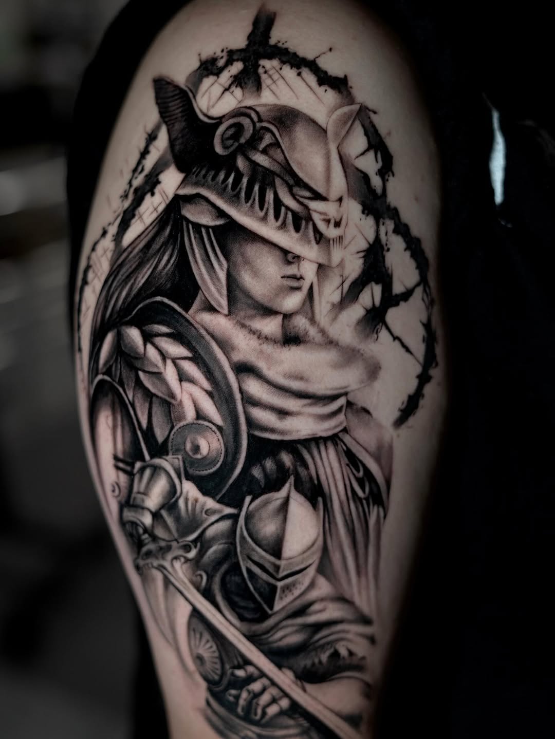 Warrior with helmet and sword realism tattoo on the shoulder by Charlotte Tattoo Artist